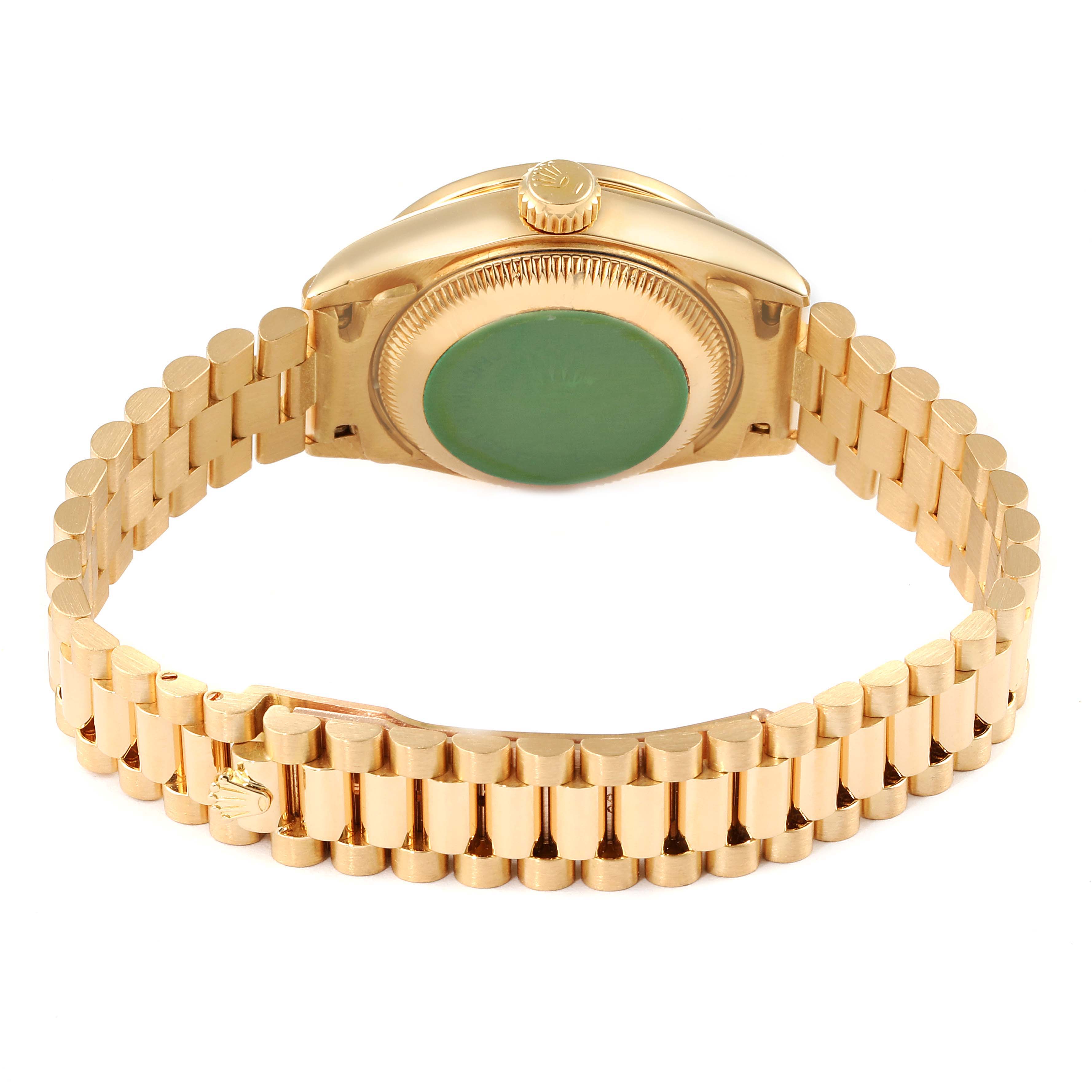 The image shows the back view of a Rolex President 69158 Women
s Yellow Gold Champagne Dial 69158 Women
s Yellow Gold Champagne Dial model watch, highlighting its gold case back and bracelet.