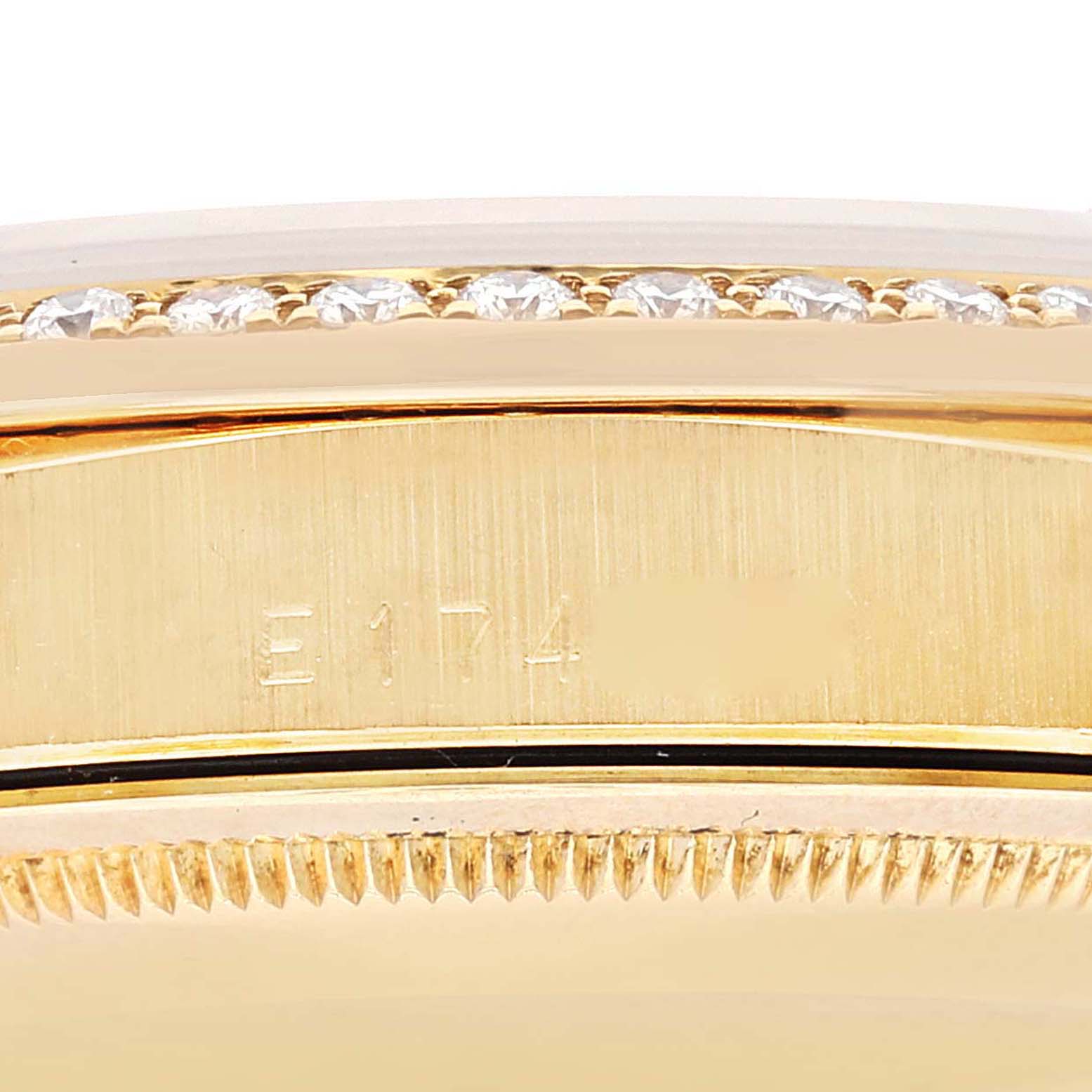This image shows a close-up of the side of the bezel and case of a President model Rolex watch, featuring diamond accents.