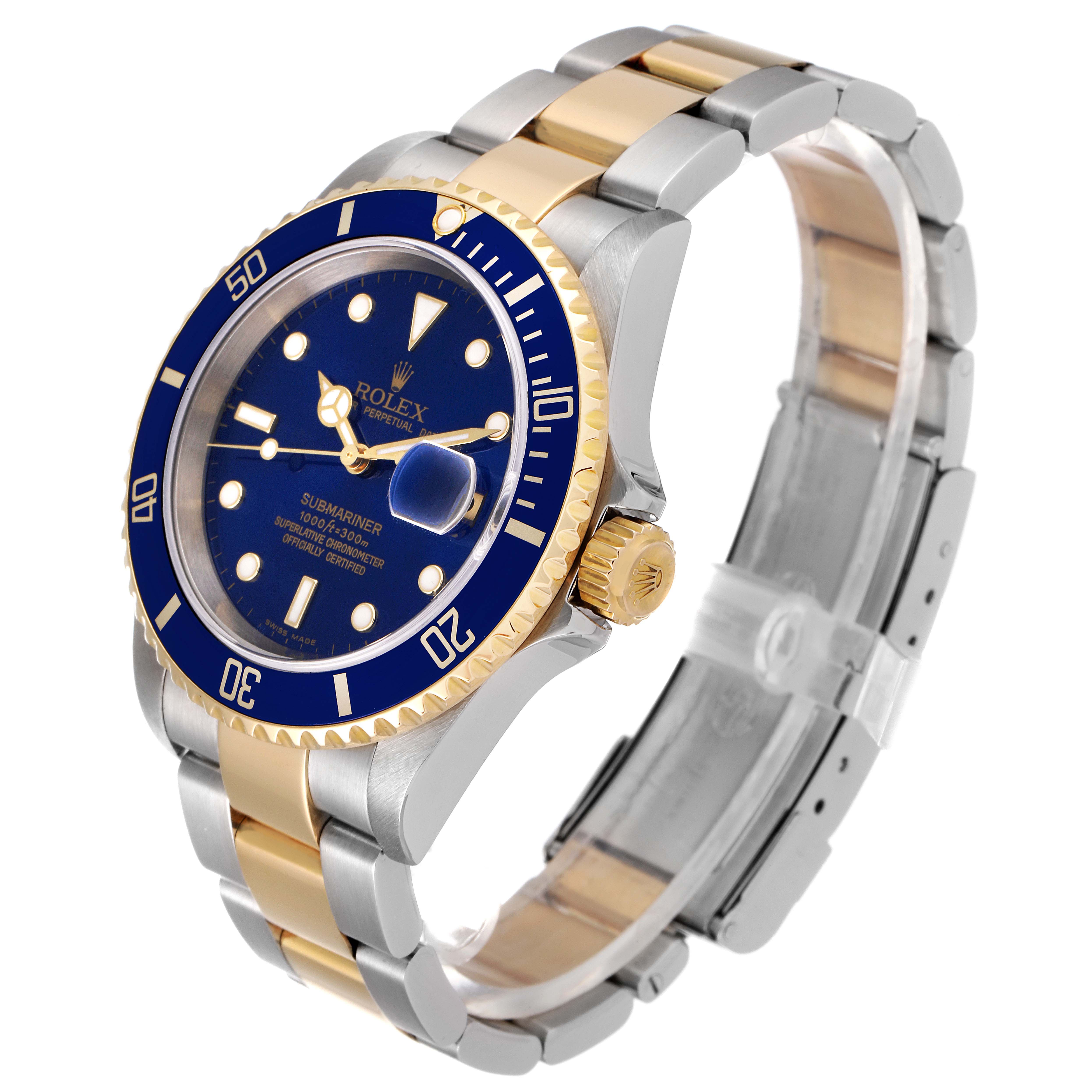 The image shows a Rolex Submariner 16613 Men's Steel and Gold (two tone) Blue Dial 16613 Men's Steel and Gold (two tone) Blue Dial watch at an angled view, highlighting its blue dial, bezel, and two-tone bracelet.