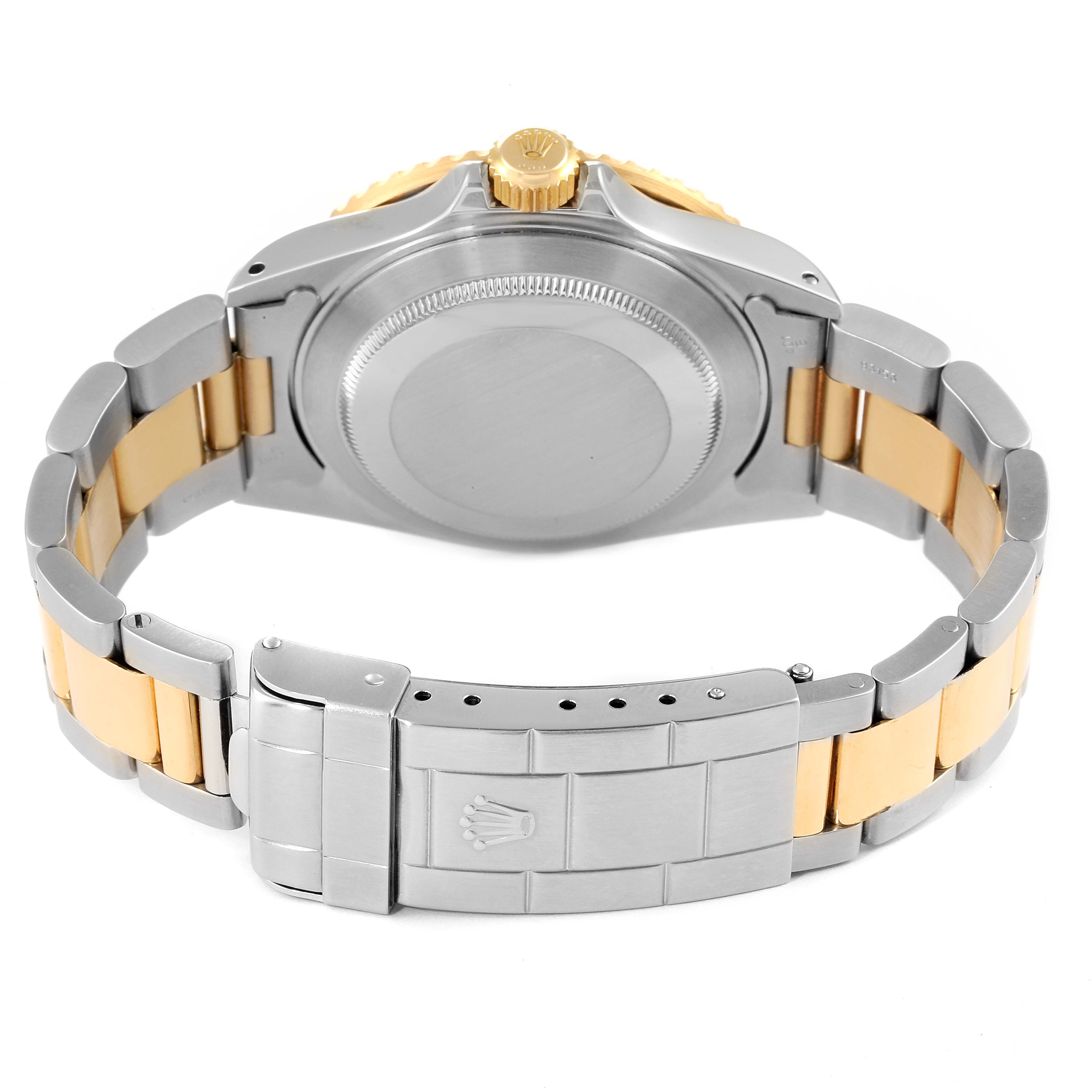 This image shows the back case, crown, and bracelet of the Rolex Submariner 16613 Men
s Steel and Gold (two tone) Blue Dial 16613 Men
s Steel and Gold (two tone) Blue Dial watch from a rear angle.