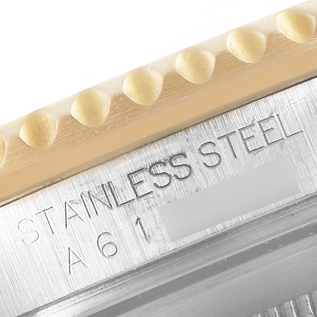 This close-up image shows the engraving on the stainless steel case and bezel of a Rolex Submariner 16613 Men
s Steel and Gold (two tone) Blue Dial 16613 Men
s Steel and Gold (two tone) Blue Dial watch.