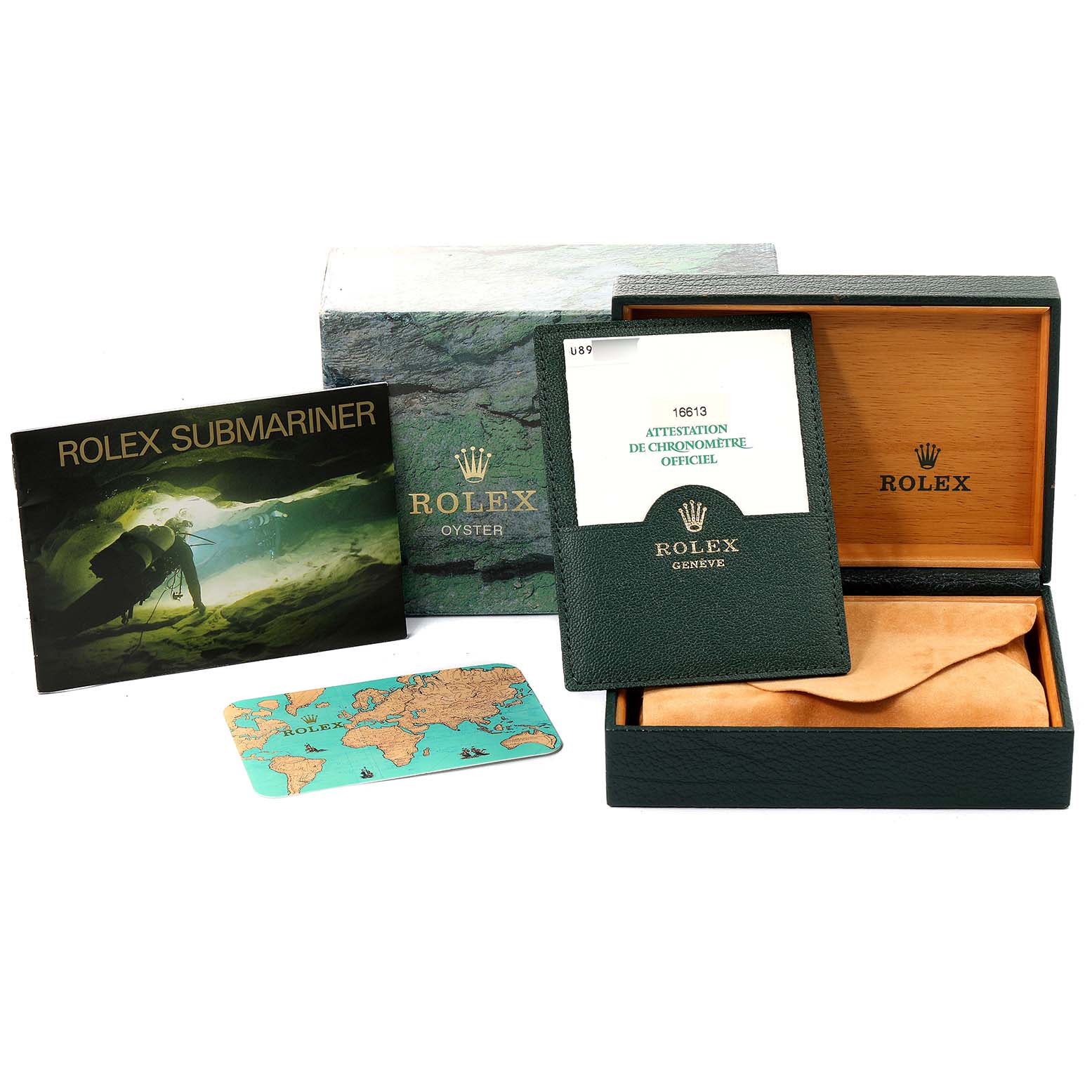 The image shows the Rolex Submariner 16613 Men's Steel and Gold (two tone) Blue Dial 16613 Men's Steel and Gold (two tone) Blue Dial watch's box, a certificate, a booklet, and an accessory card from a top-down angle.