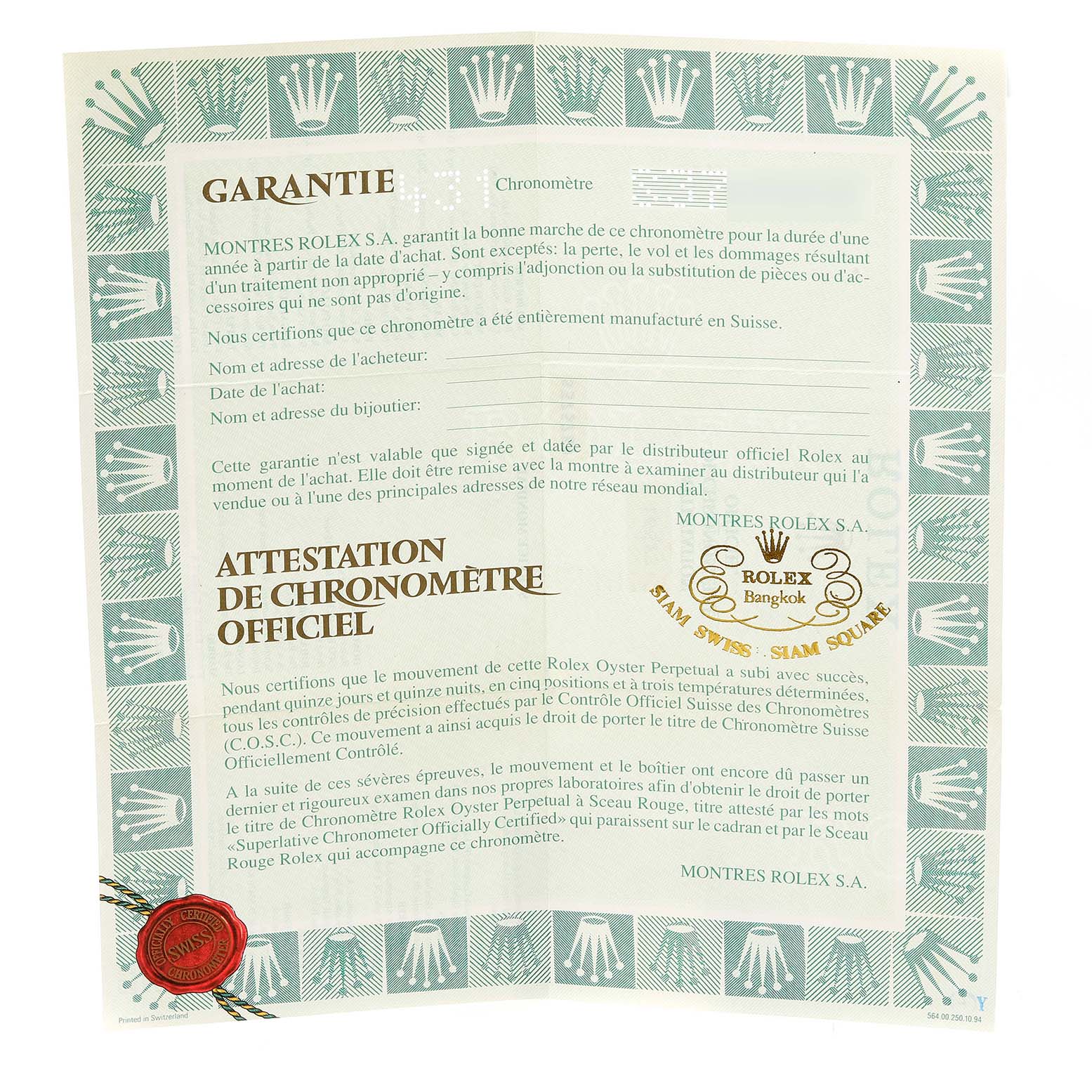 This image shows a warranty certificate by Rolex for the Submariner model, detailing authentication and chronometer certification.