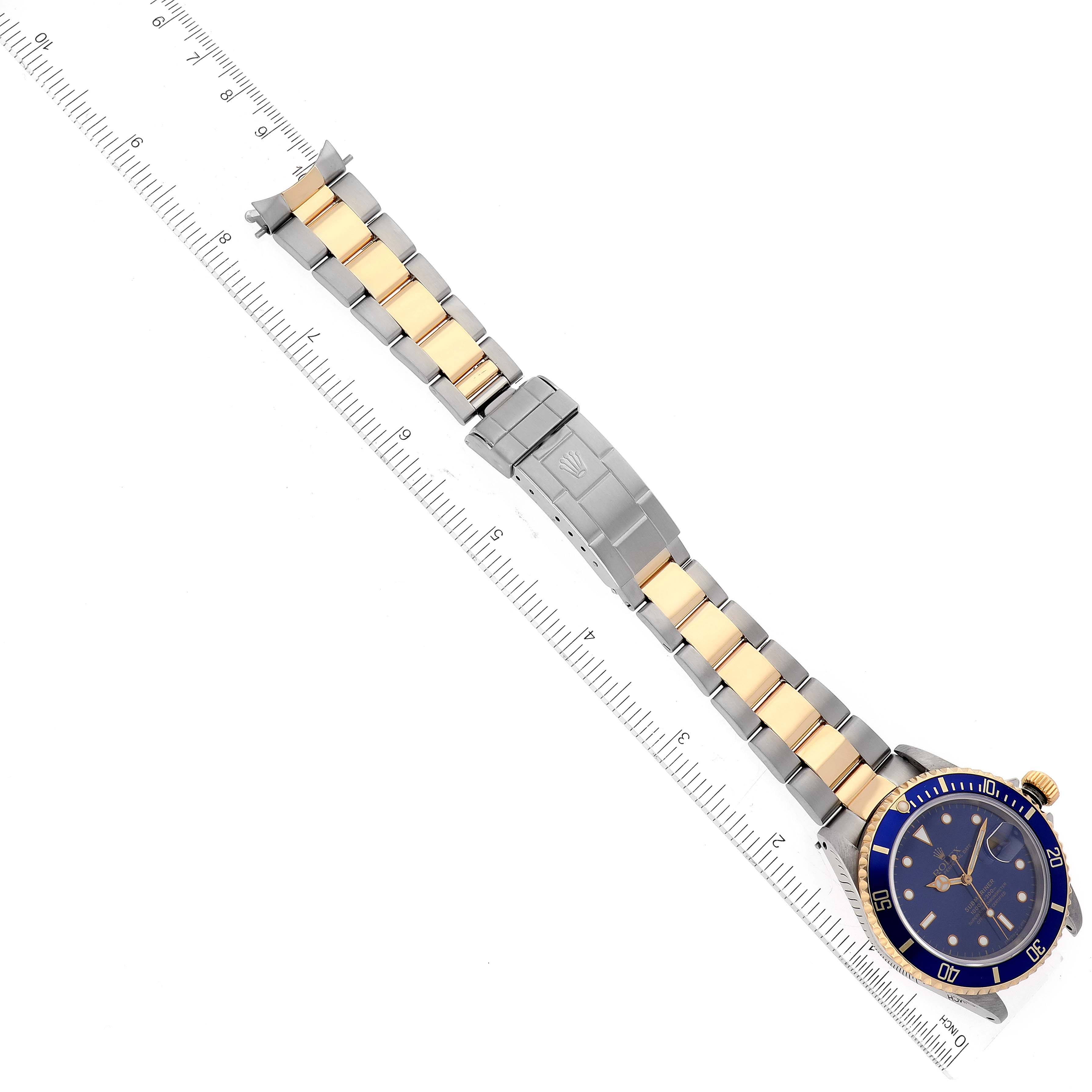 The image shows a top-down view of a Rolex Submariner 16613 Men's Steel and Gold (two tone) Blue Dial 16613 Men's Steel and Gold (two tone) Blue Dial watch, including its dial, bezel, and two-tone bracelet with clasp.