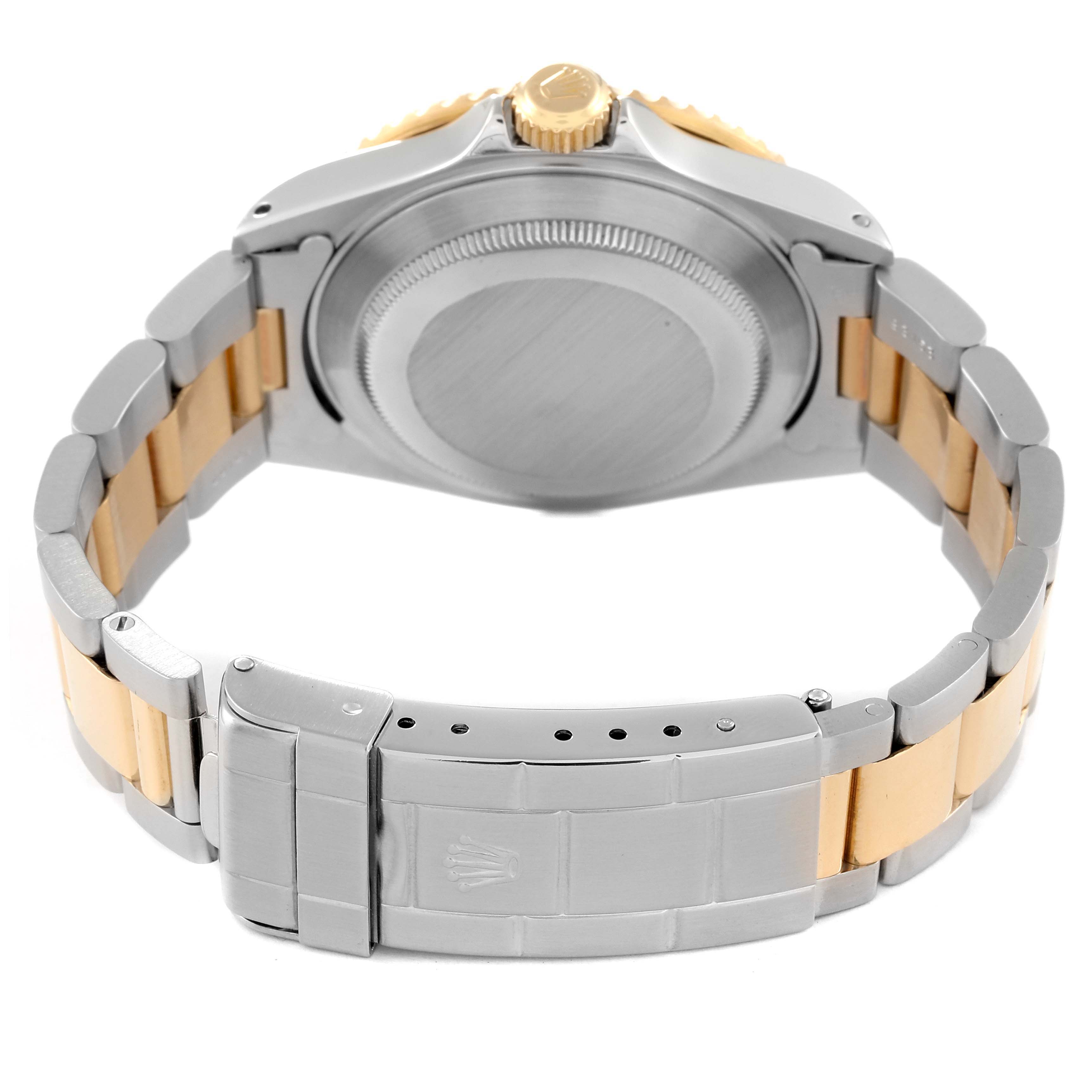 This image shows the back view of the Rolex Submariner 16613 Men's Steel and Gold (two tone) Blue Dial 16613 Men's Steel and Gold (two tone) Blue Dial watch, focusing on the case back and the two-tone bracelet with the clasp.