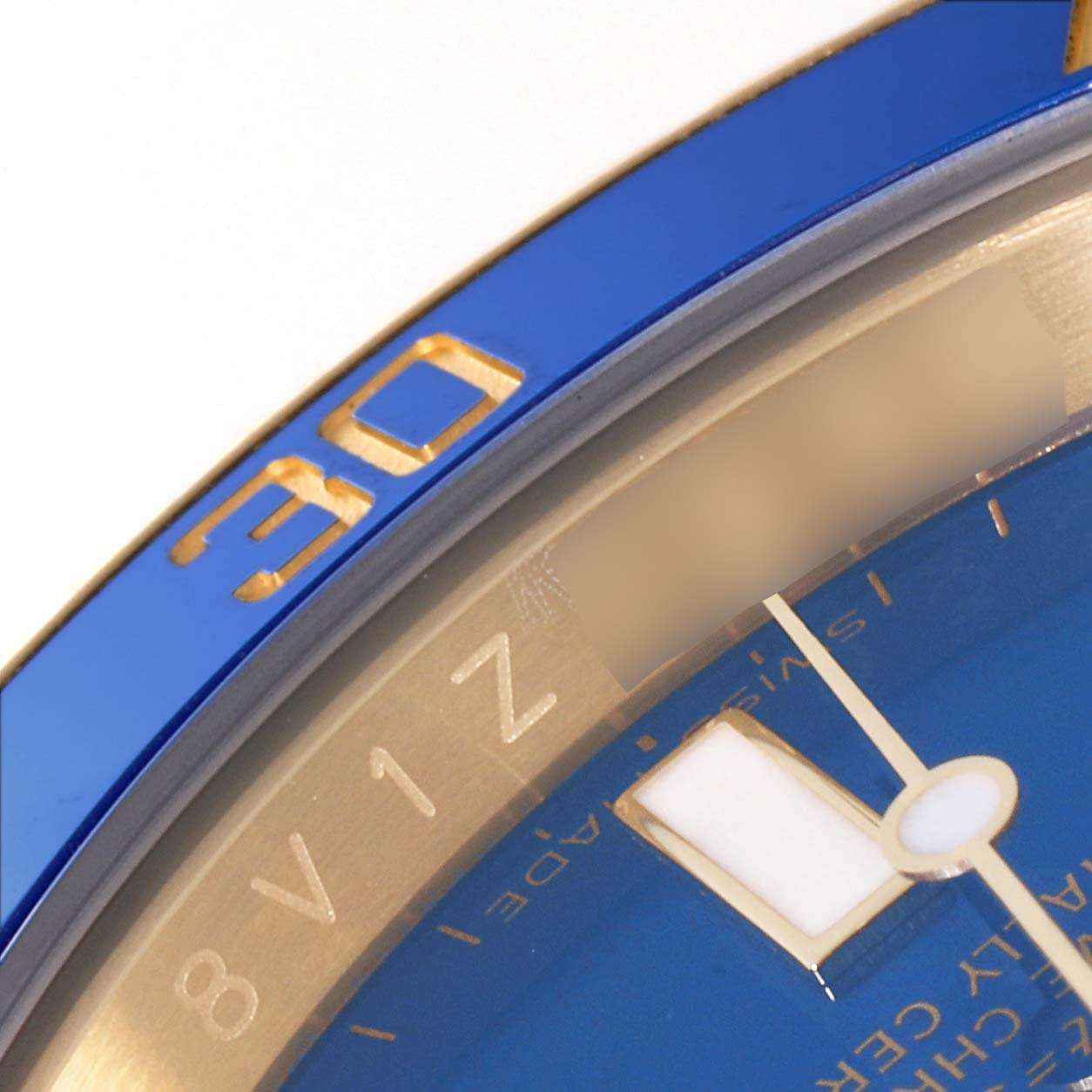 This close-up angle shows part of the blue bezel and dial of the Rolex Submariner 116618 Men's Yellow Gold Blue Dial 116618 Men's Yellow Gold Blue Dial watch.