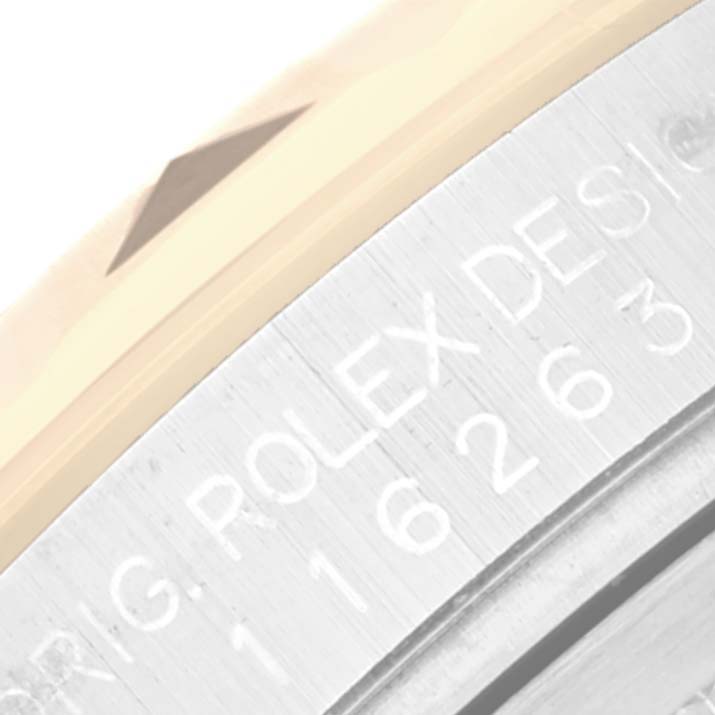 The image shows a close-up of the engraved serial number on the bezel edge of a Rolex Turn-o-Graph 116263 Men's Steel and Gold (two tone) White Dial 116263 Men's Steel and Gold (two tone) White Dial watch.