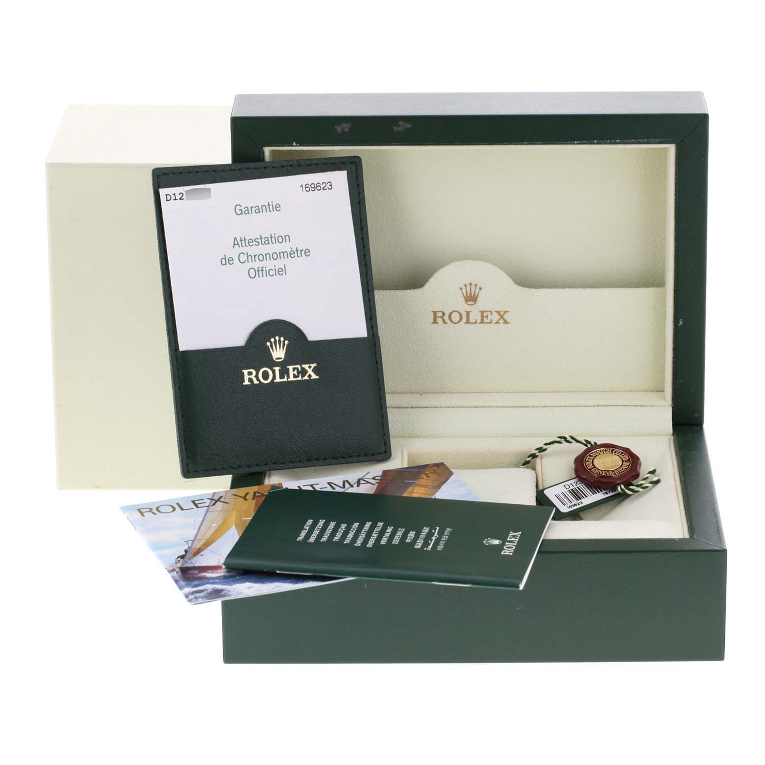 The image shows the accessories of a Rolex Yacht-Master 169623 Women
s Steel and Gold (two tone) White Dial 169623 Women
s Steel and Gold (two tone) White Dial watch, including the guarantee card, documents, and packaging box, from a front angle.
