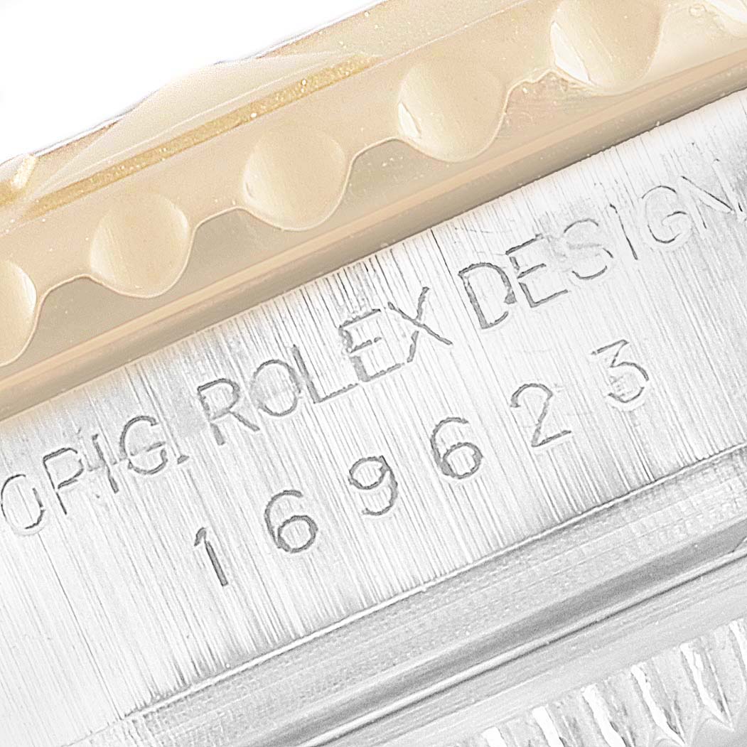 This close-up angle shows the engraved Rolex brand name and model number on the Yacht-Master bezel.