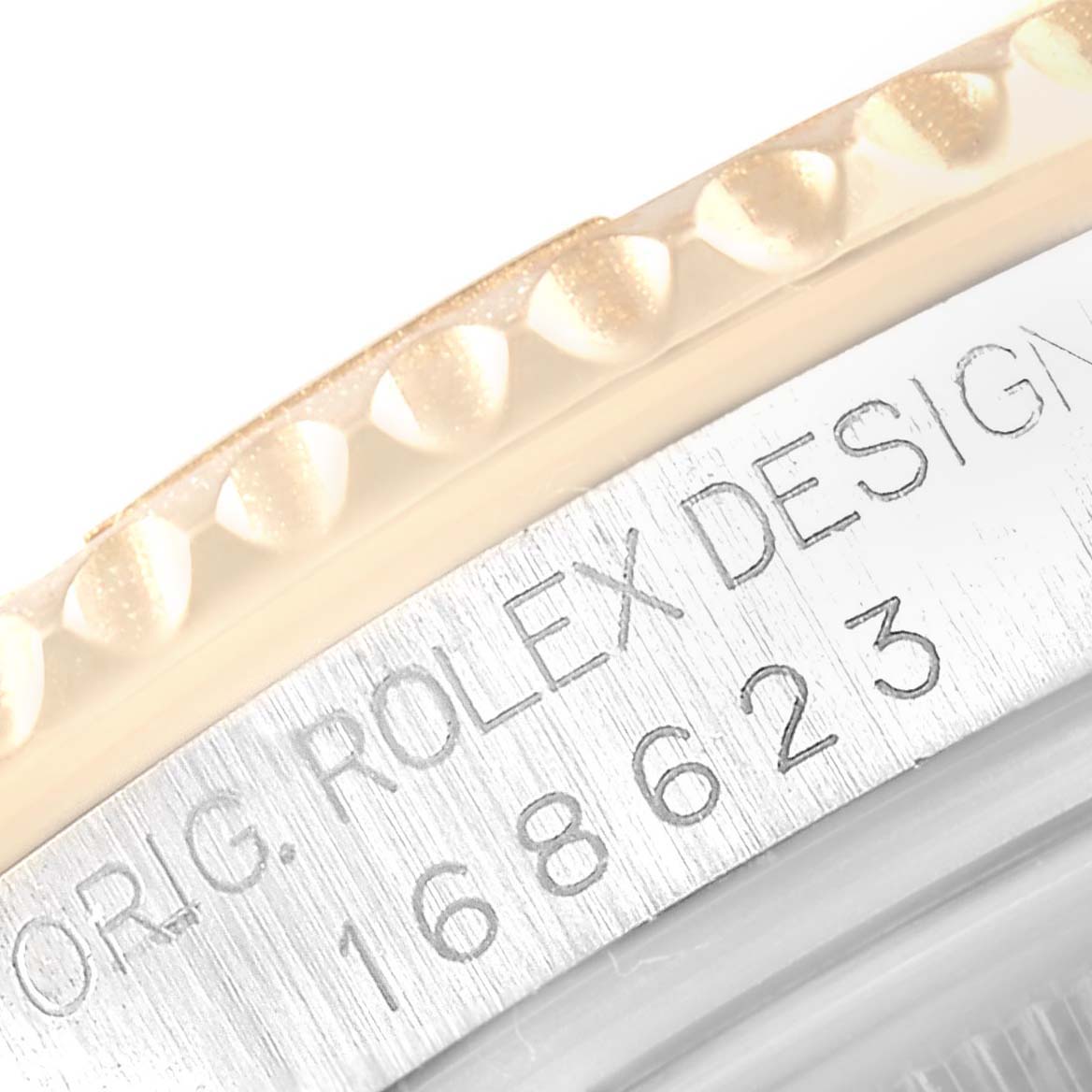 This close-up image of the Rolex Yacht-Master 168623 Men
s Steel and Gold (two tone) White Dial 168623 Men
s Steel and Gold (two tone) White Dial watch shows part of the bezel and the engraved model number "168623" on the case.