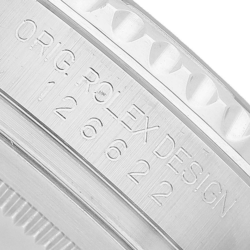 The close-up image shows the engraved details on the bezel or edge of the Rolex Yacht-Master M126622-0001 Men's Stainless Steel Grey Dial watch.