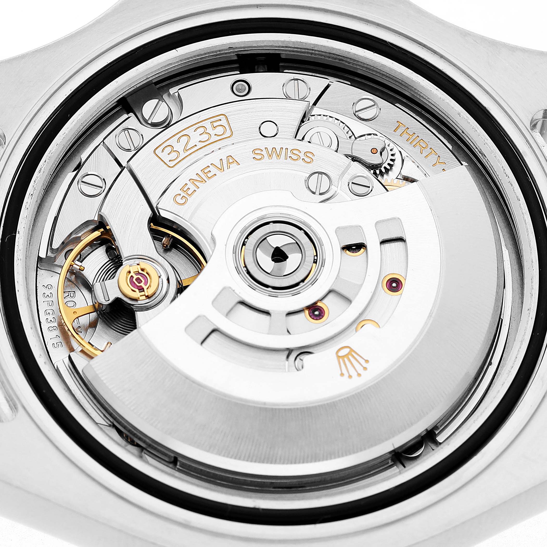 The image shows the movement of a Rolex Yacht-Master M126622-0001 Men's Stainless Steel Grey Dial watch, featuring the intricate mechanics and the rotor.