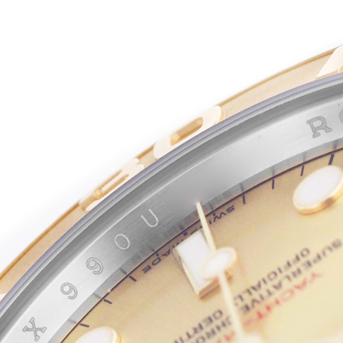 The image shows a close-up of the Rolex Yacht-Master 16623 Men's Stainless Steel Champagne Dial's dial and bezel at an angle, highlighting the serial engraving.