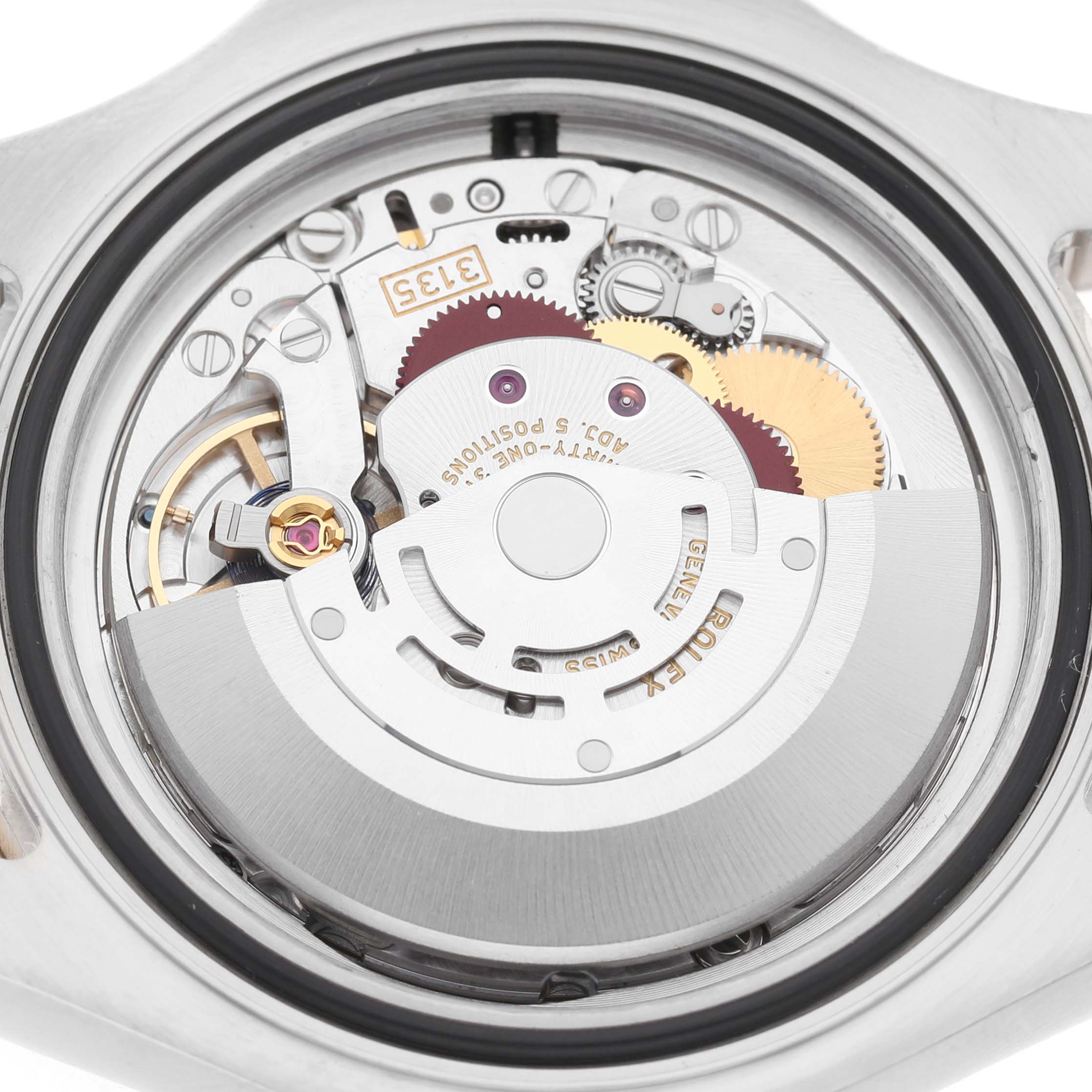 The image shows the inner mechanism of a Rolex Yacht-Master 16623 Men's Stainless Steel Champagne Dial watch viewed from the back, highlighting gears and the rotor.