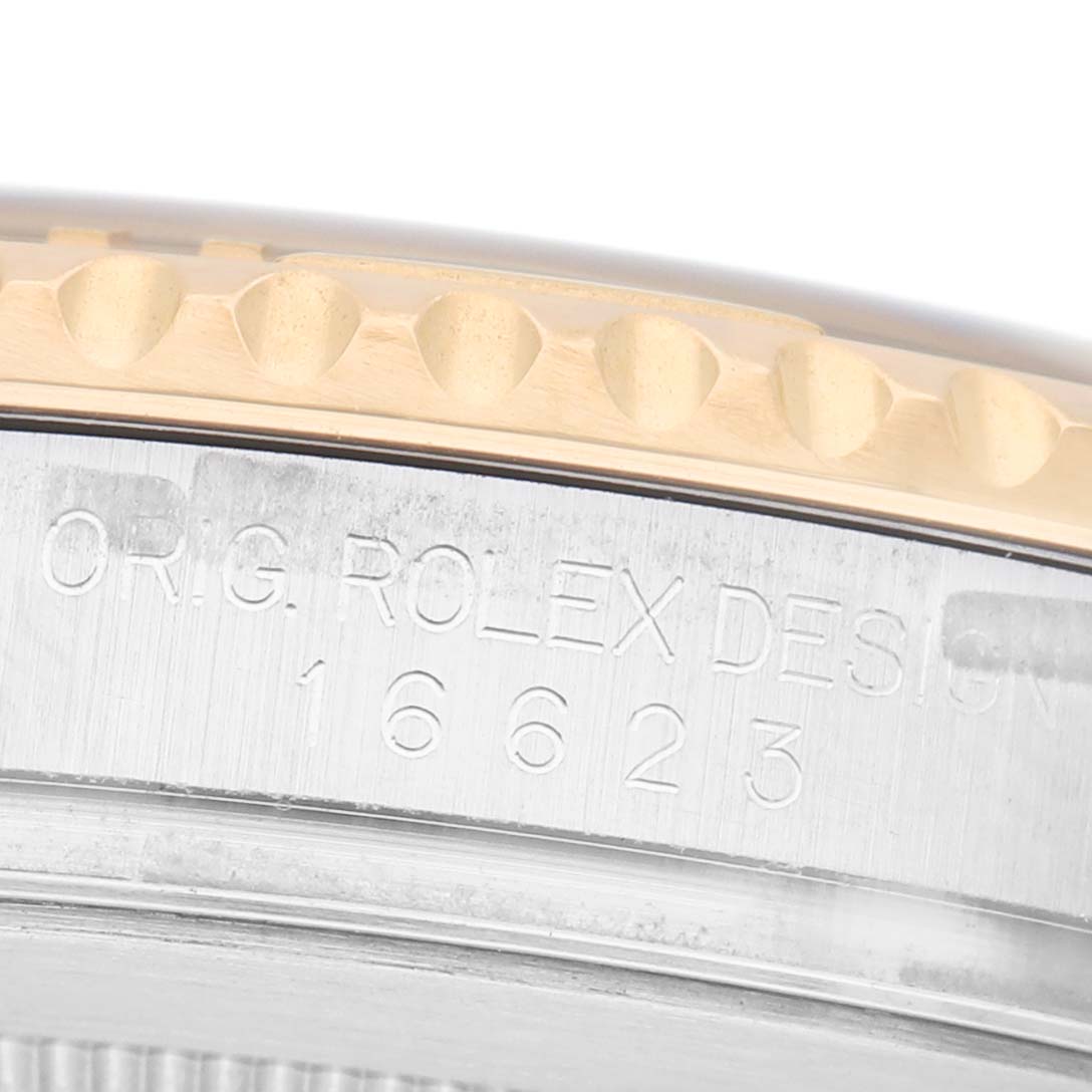 The image shows a close-up side view of the Rolex Yacht-Master 16623 Men's Stainless Steel Champagne Dial model, focusing on the engraved case and bezel edge.