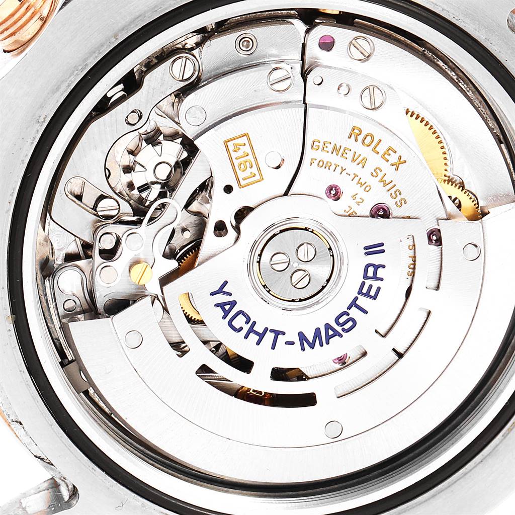 The image shows a close-up of the Rolex Yacht-Master 116681 Men
s Steel and Gold (two tone) White Dial 116681 Men
s Steel and Gold (two tone) White Dial model
s internal mechanism from a rear angle.