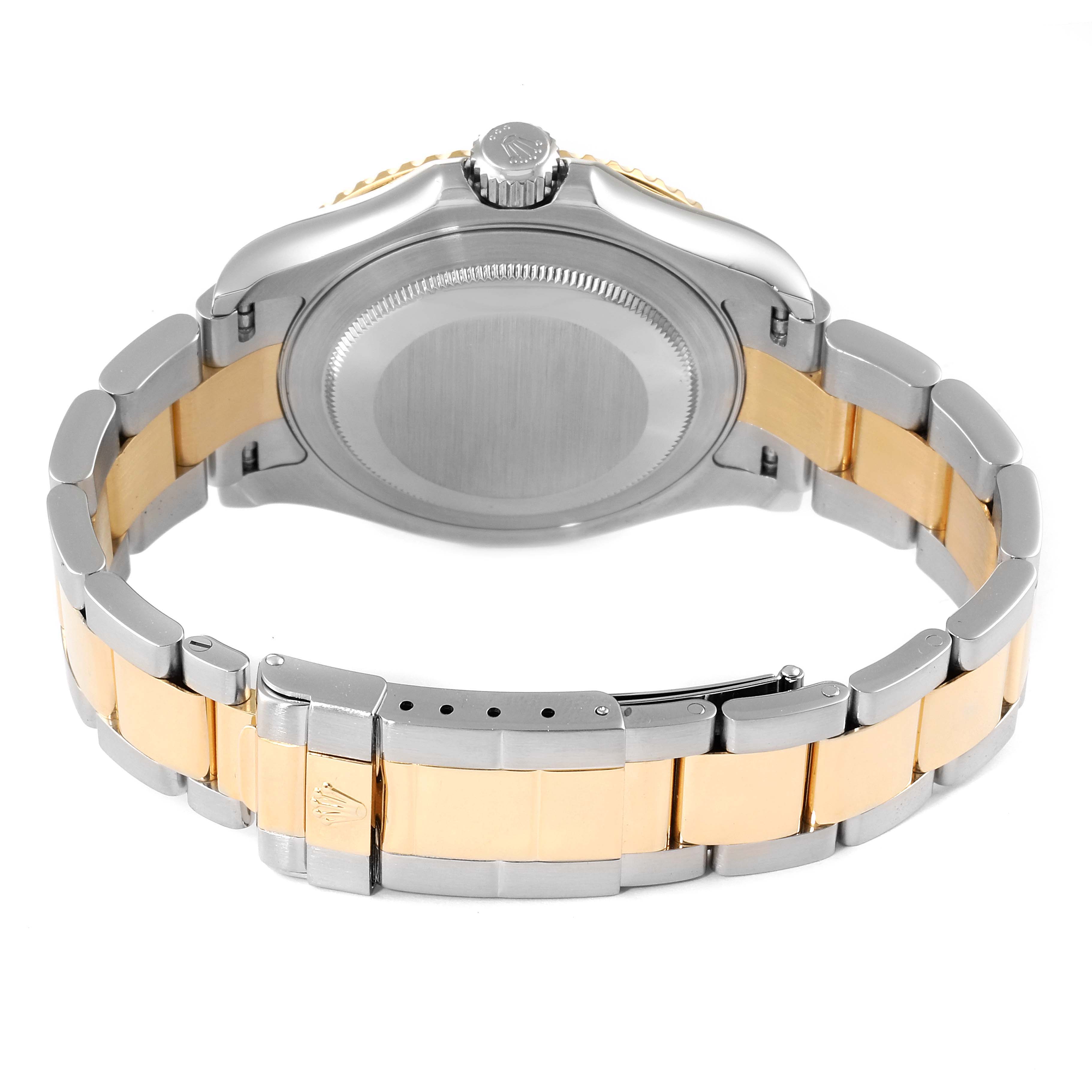 The image shows the back view of a Rolex Yacht-Master 16623 Men
s Steel and Gold (two tone) White Dial 16623 Men
s Steel and Gold (two tone) White Dial watch, highlighting its case back, crown, and two-tone bracelet with clasp.