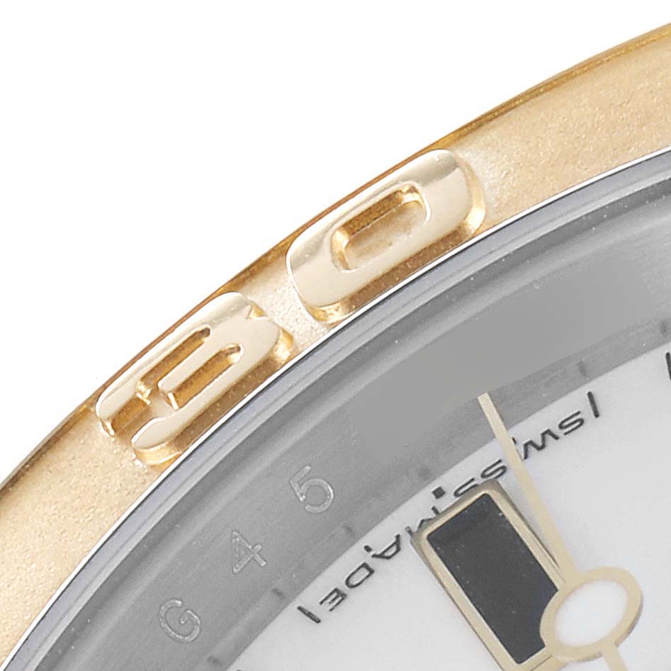 The image shows a close-up angle of the bezel and part of the dial of a Rolex Yacht-Master 16623 Men
s Steel and Gold (two tone) White Dial 16623 Men
s Steel and Gold (two tone) White Dial watch.
