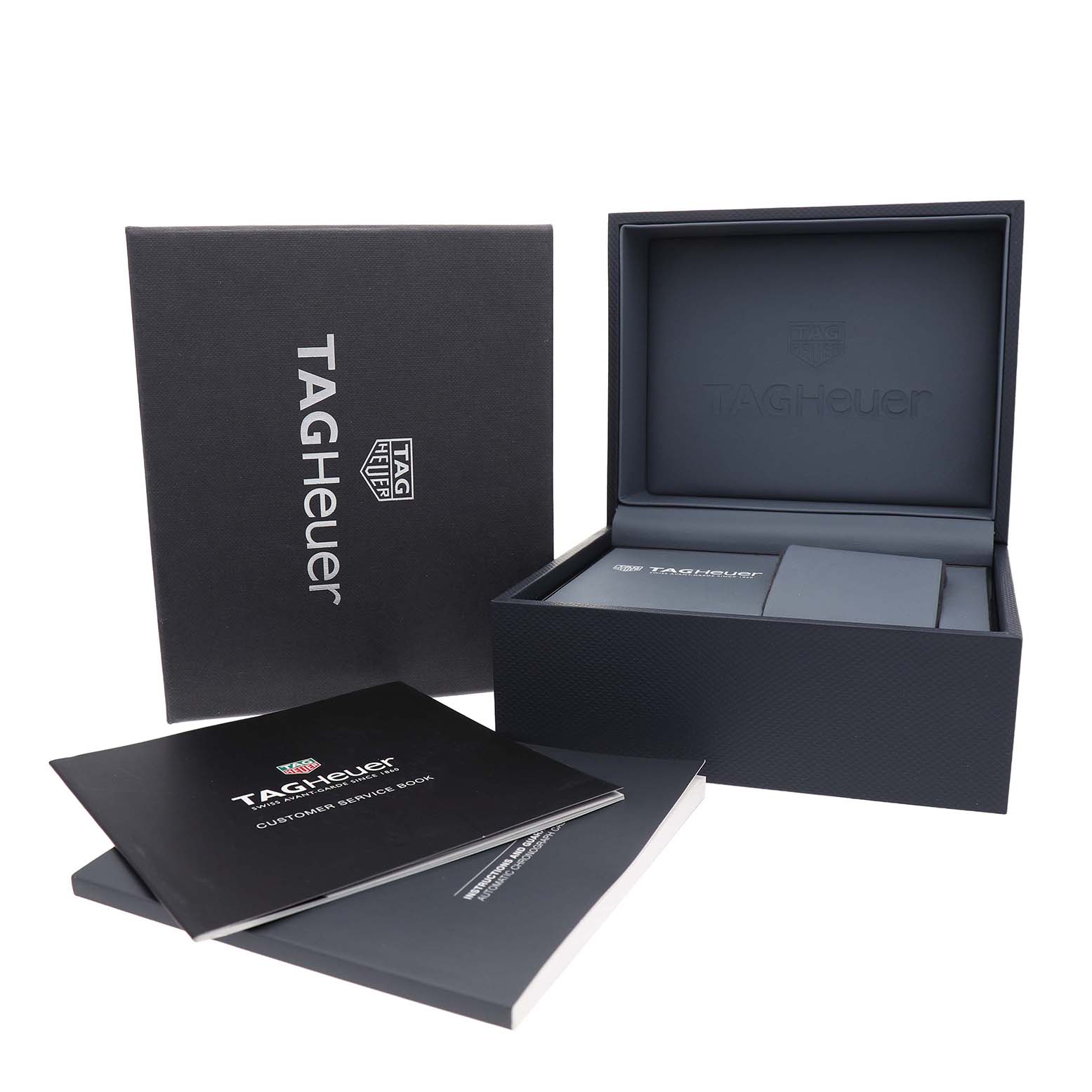 This image shows the packaging and manuals of the TAG Heuer Carrera watch.