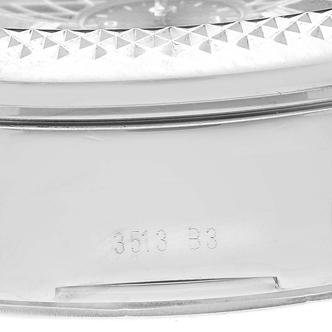 The image shows a close-up of the side of a Bentley model by Breitling, highlighting the bezel and the case with a partial serial number.