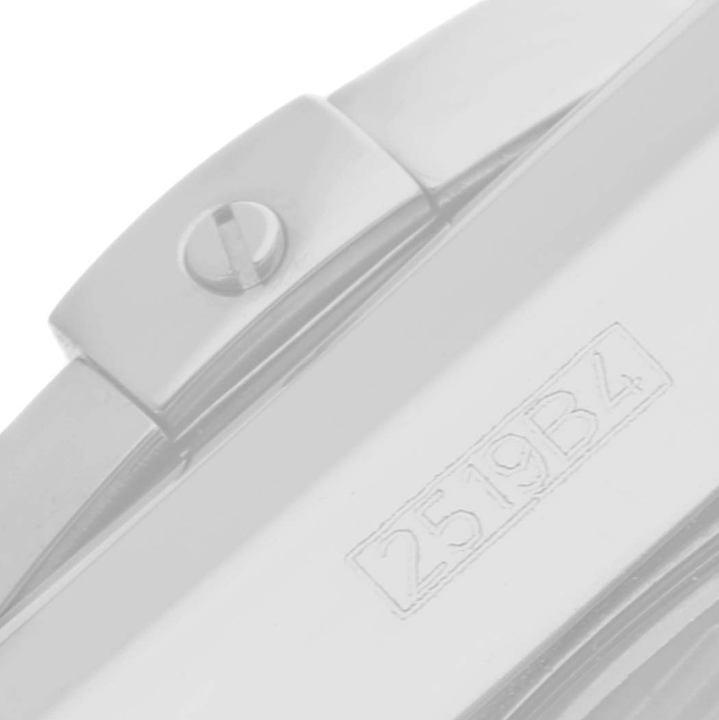 The image shows a close-up of the clasp and part of the case of the Breitling Chronomat AB0115 Men's Stainless Steel Mother of Pearl Dial AB0115 Men's Stainless Steel Mother of Pearl Dial watch, including a visible serial number.