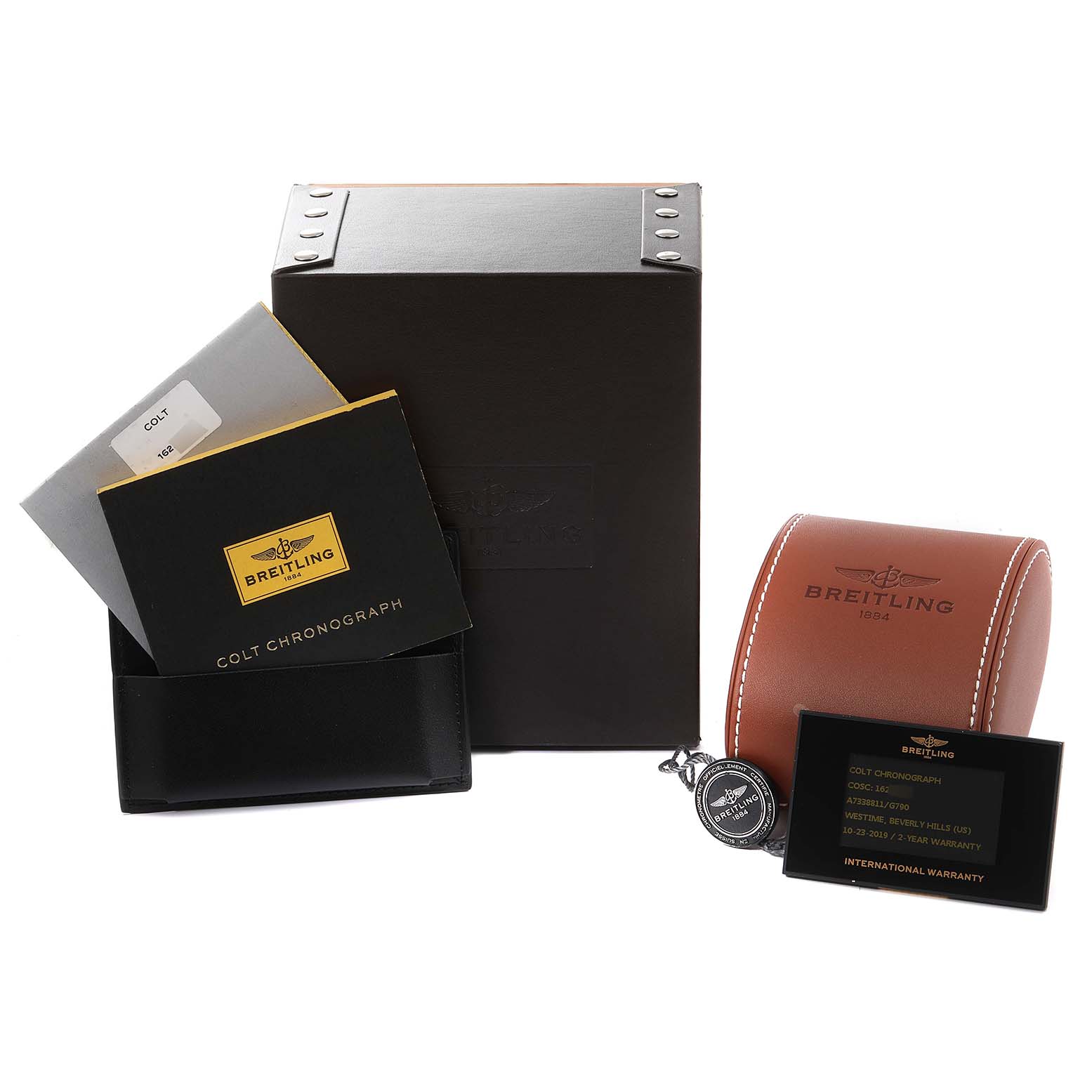 The image shows packaging and accessories of the Breitling Colt A73388 Men
s Stainless Steel White Dial A73388 Men
s Stainless Steel White Dial watch model, including a box, manuals, a case, and a warranty card.