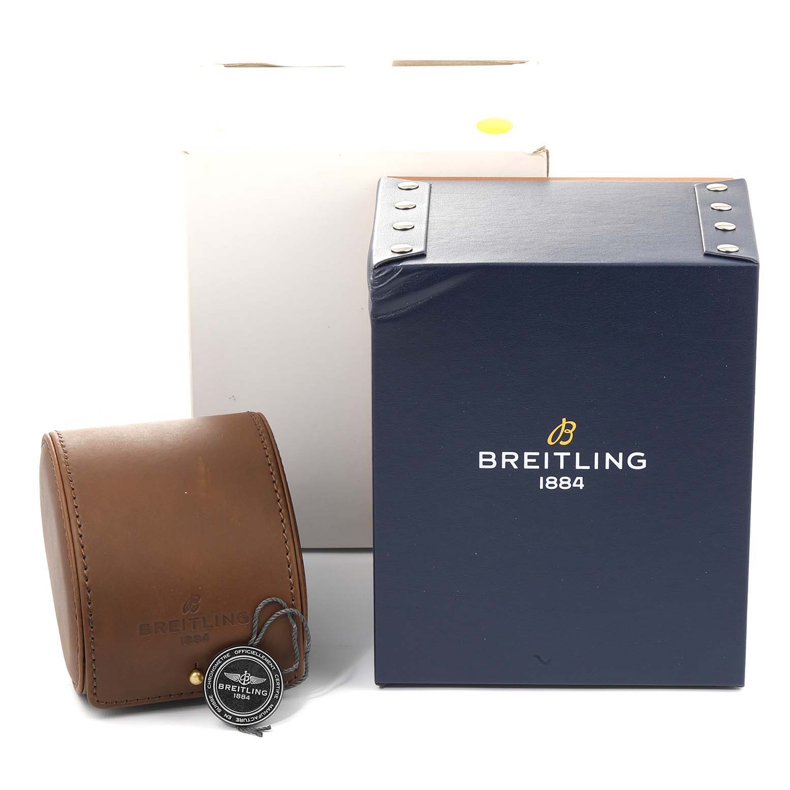 This image shows packaging for a Breitling Navitimer AB0127-211-B1A1 Men
s Stainless Steel Black Dial AB0127-211-B1A1 Men
s Stainless Steel Black Dial, including a watch box, a leather case, and a tag.