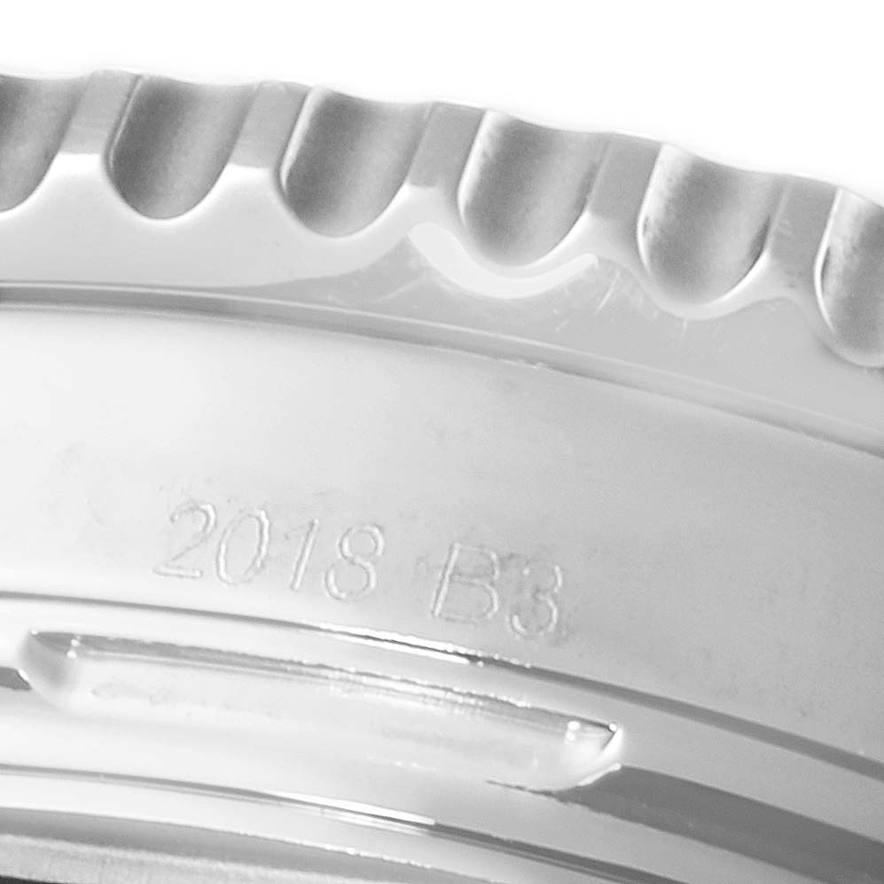 The image shows a close-up of the bezel and part of the case of a Breitling Navitimer AB0121 Men's Stainless Steel Blue Dial AB0121 Men's Stainless Steel Blue Dial watch, with "2018 B3" engraved.