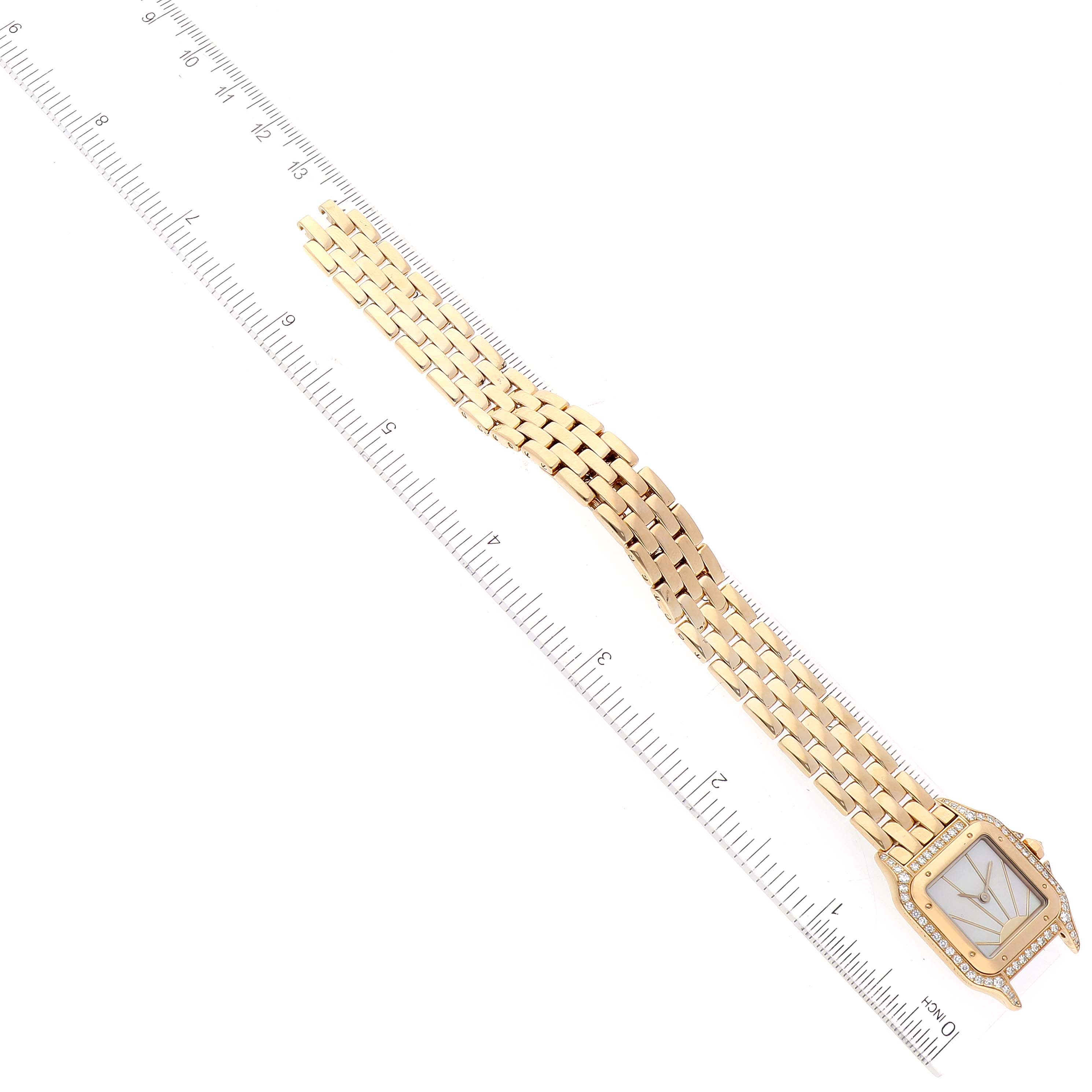 The image shows a Panthere model watch by Cartier, featuring the face and bracelet at a diagonal angle with a ruler for scale.