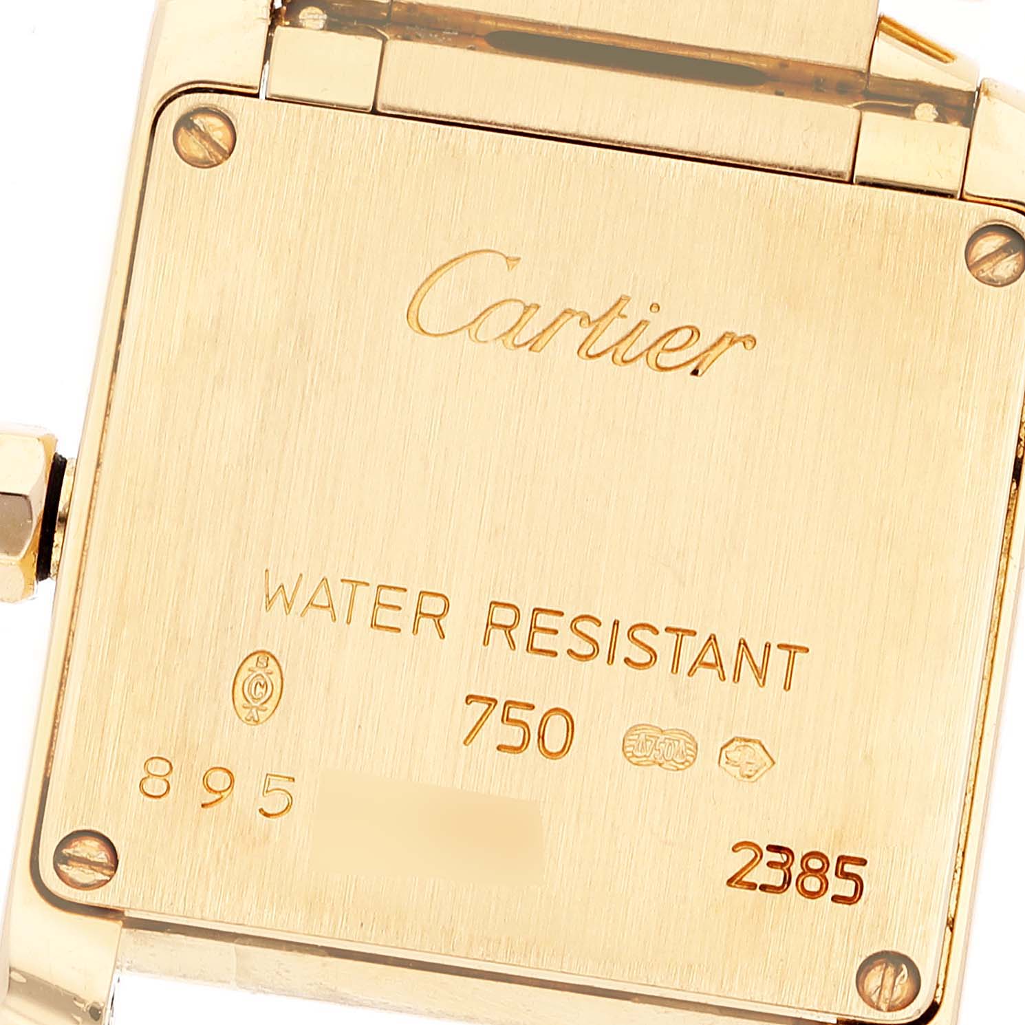 This image shows the back case of a Cartier Tank Francaise WE1001R8 Women
s Yellow Gold Silver Dial WE1001R8 Women
s Yellow Gold Silver Dial watch, highlighting its engraving and water resistance details.