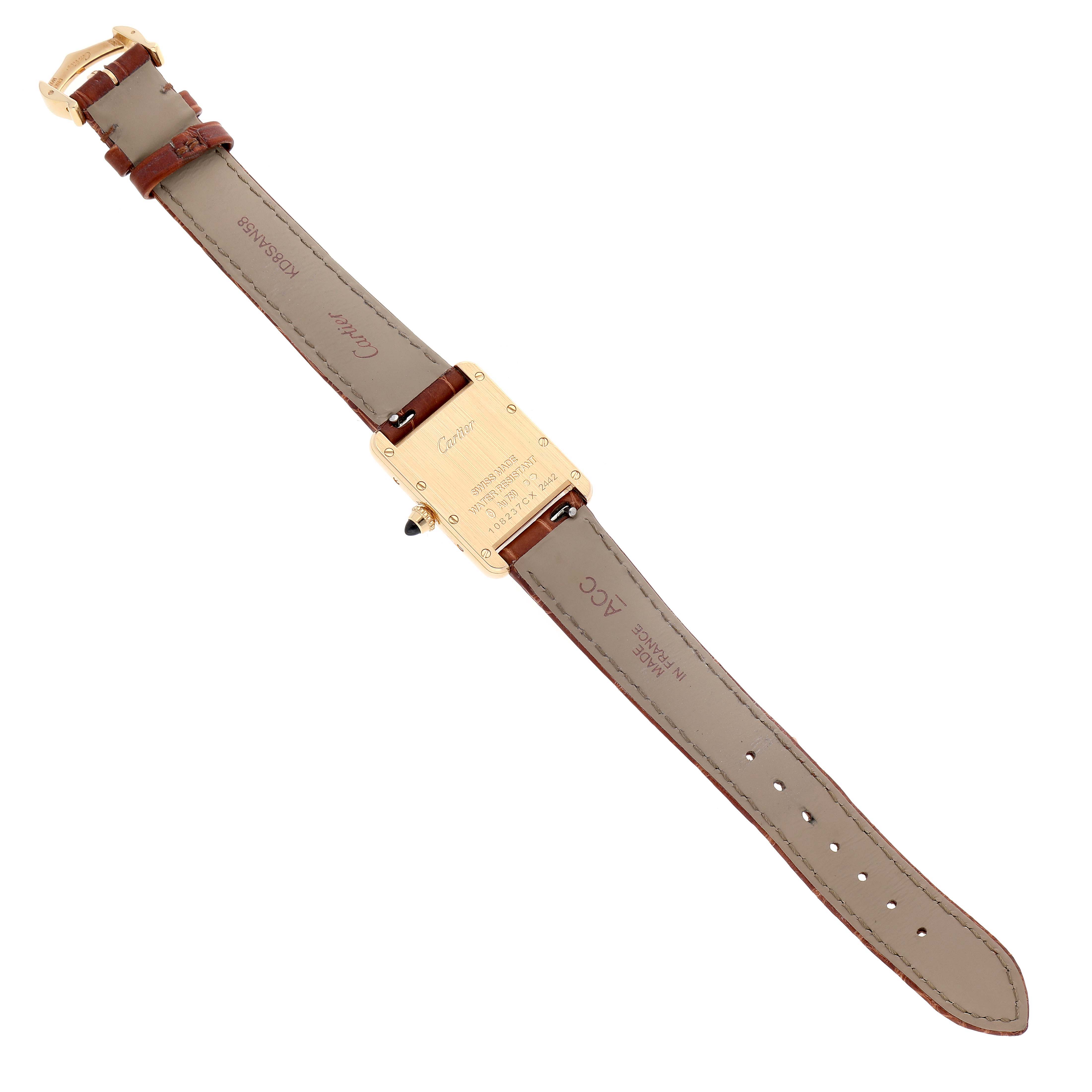 This image shows the back view of the Cartier Tank Louis W1529856 Women's Yellow Gold Silver Dial W1529856 Women's Yellow Gold Silver Dial watch, including its caseback and leather strap.