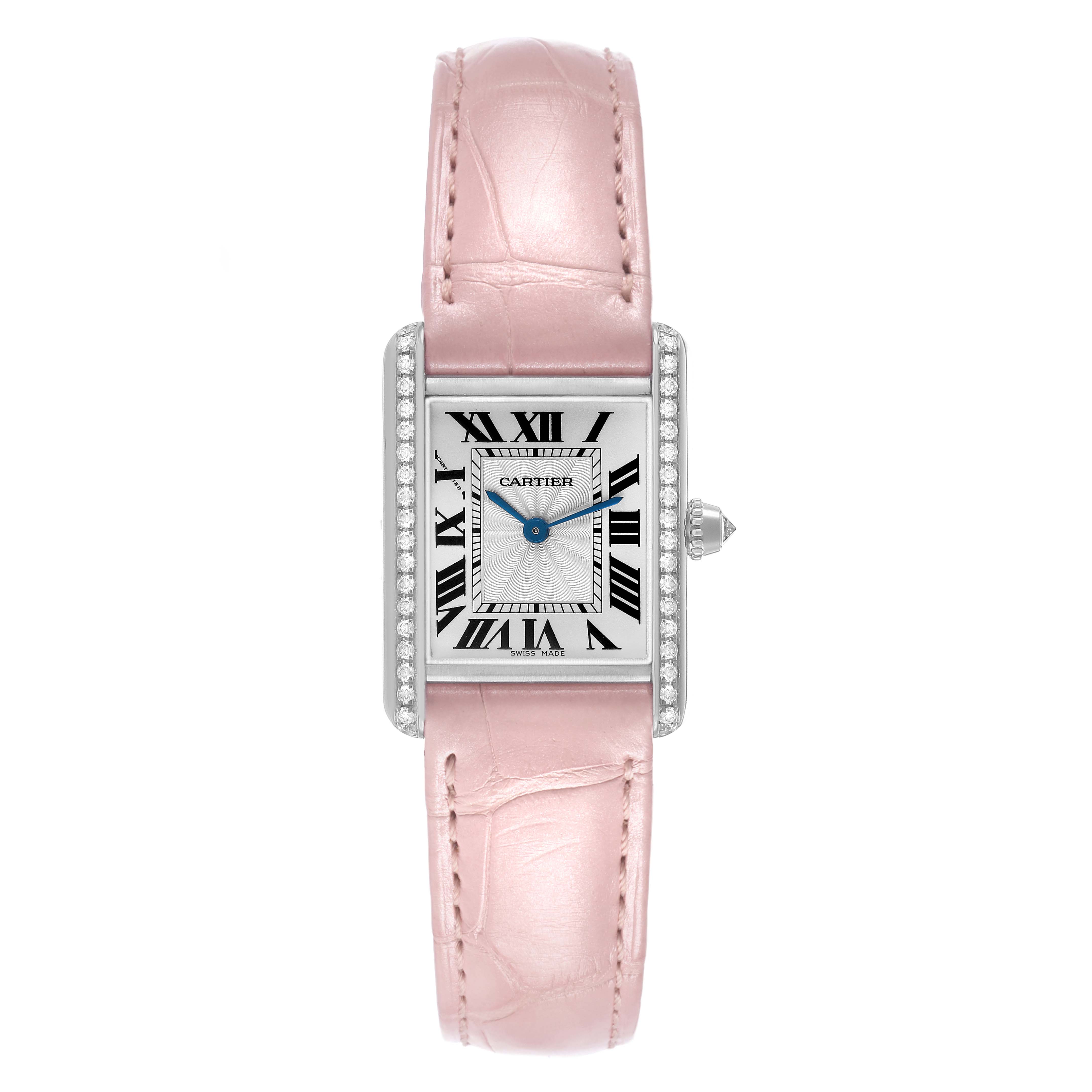 The Cartier Tank Louis WJTA0011 Women's White Gold Silver Dial watch is shown from the front, highlighting its rectangular face, pink strap, and diamond-set bezel.