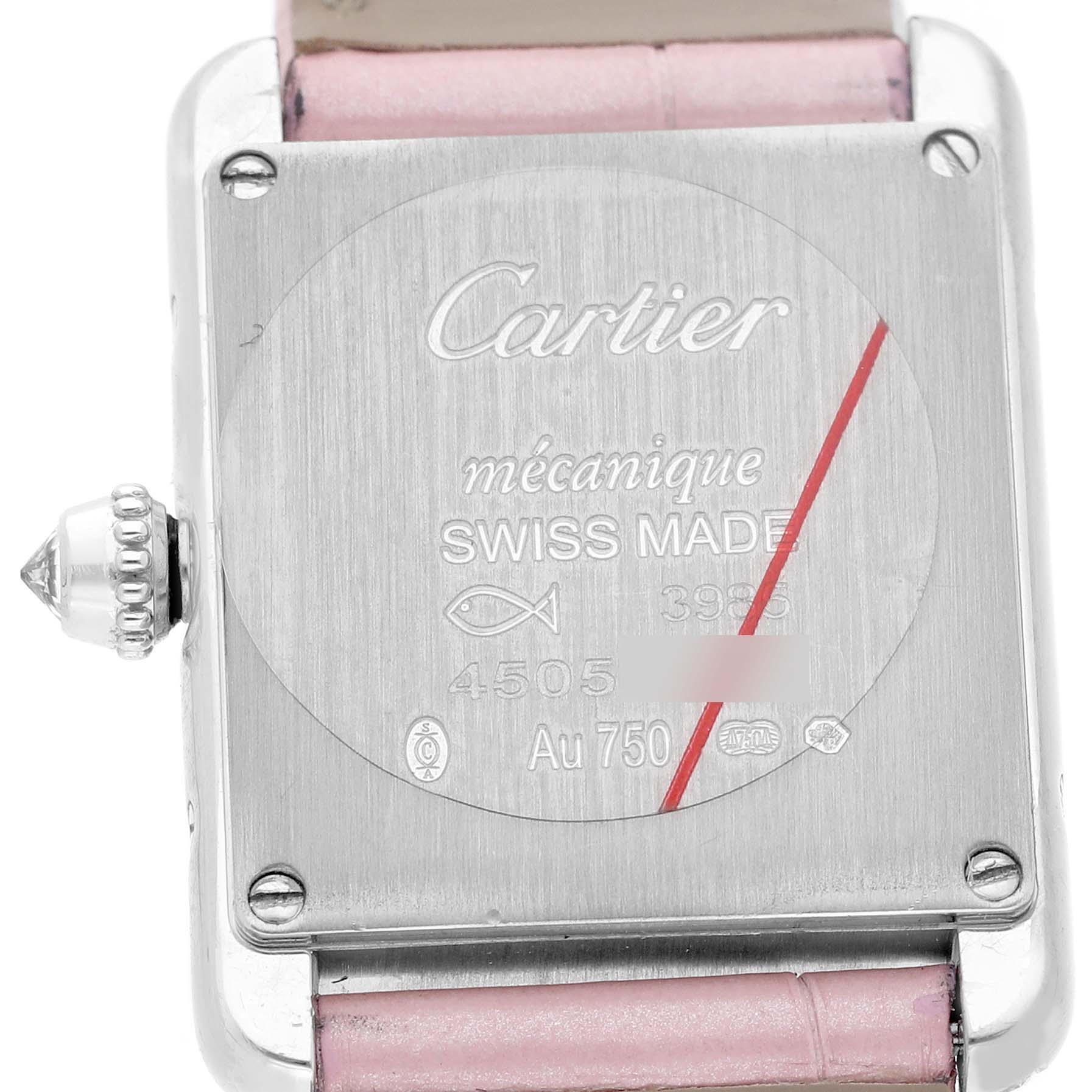 The image shows the back of a Cartier Tank Louis WJTA0011 Women's White Gold Silver Dial watch with its engraving details and a pink strap.