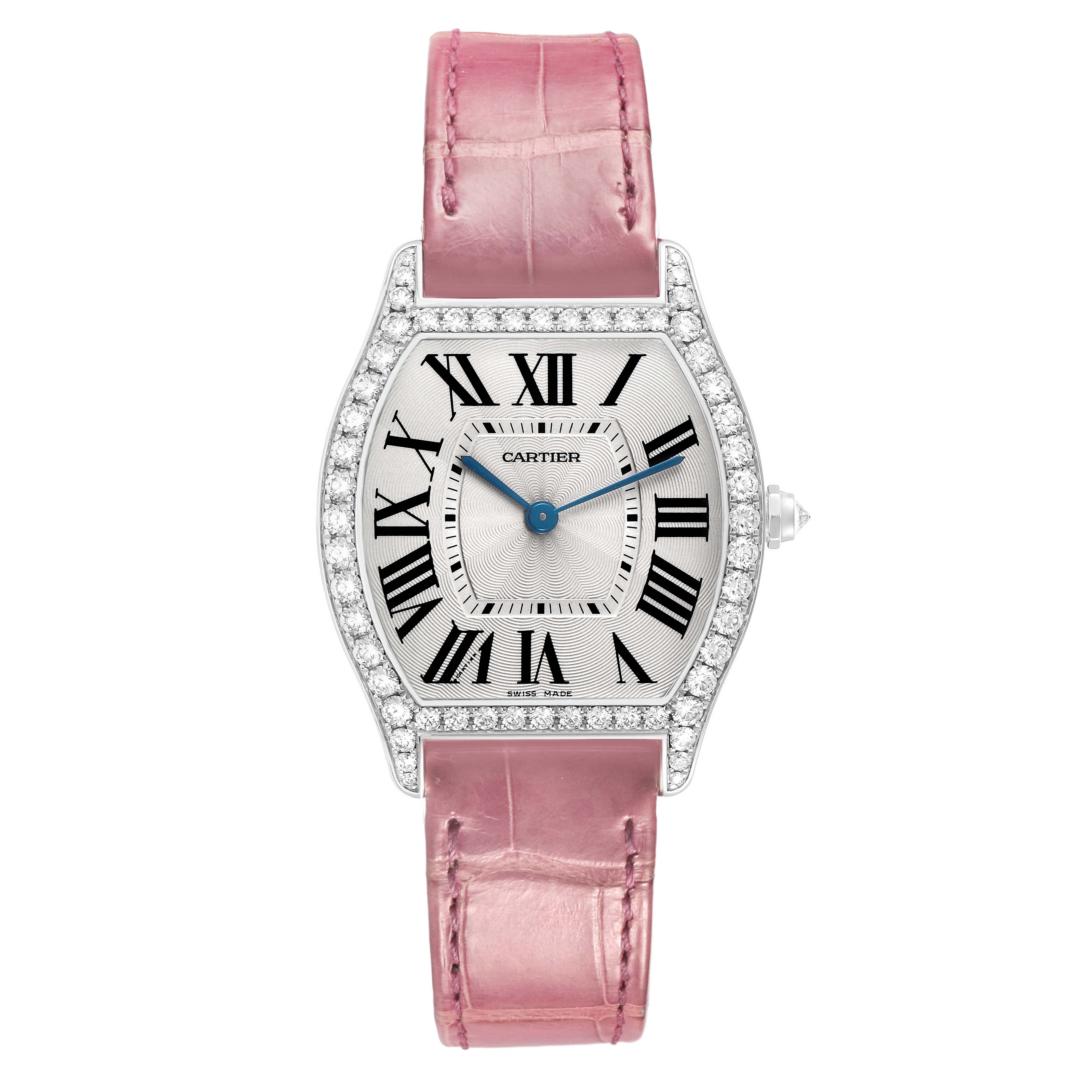 The Cartier Tortue WA501009 Women's White Gold Silver Dial watch is shown from the front, displaying its diamond-encrusted bezel, Roman numeral dial, and pink leather strap.