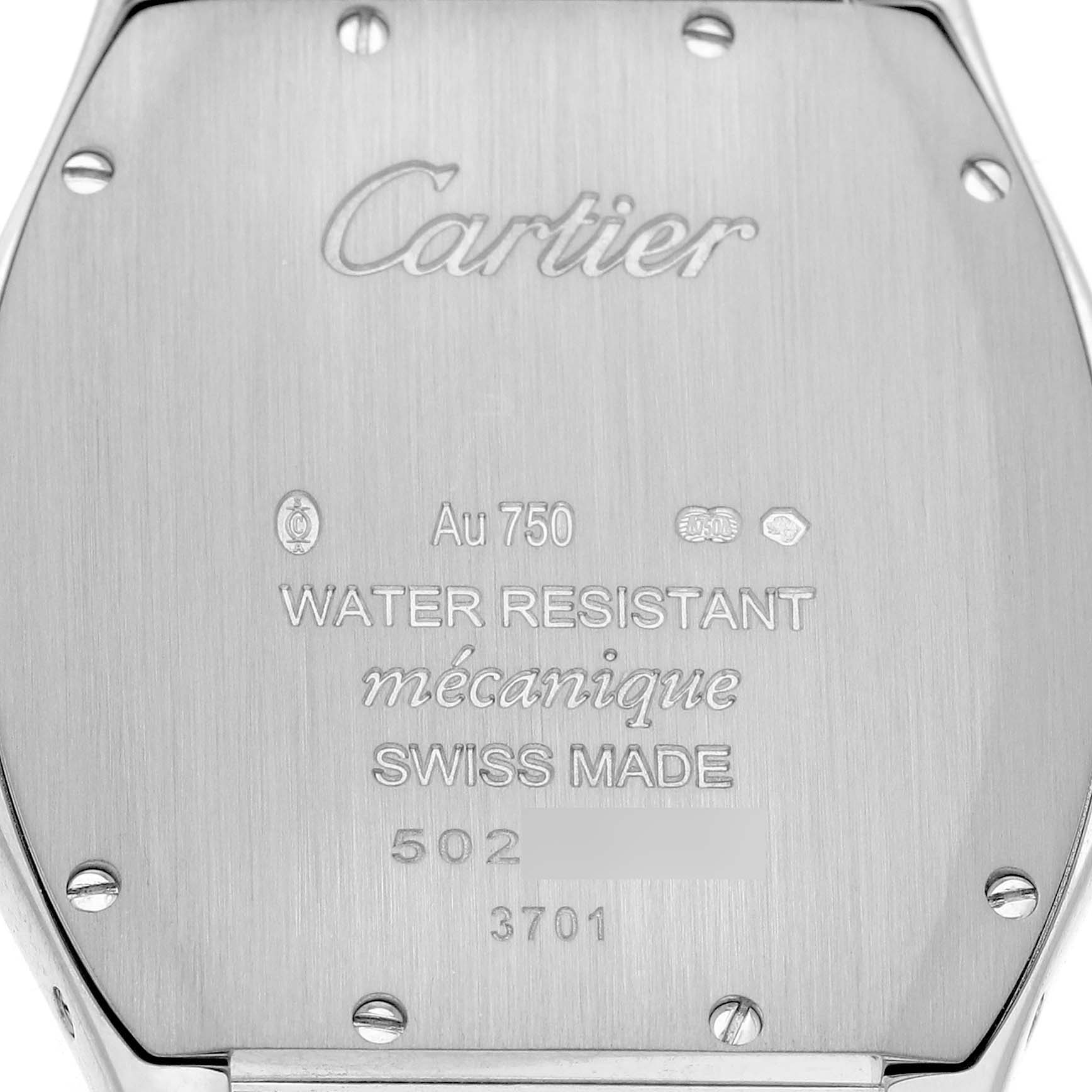 The image shows the back of a Cartier Tortue WA501009 Women's White Gold Silver Dial watch, featuring engravings and screws.