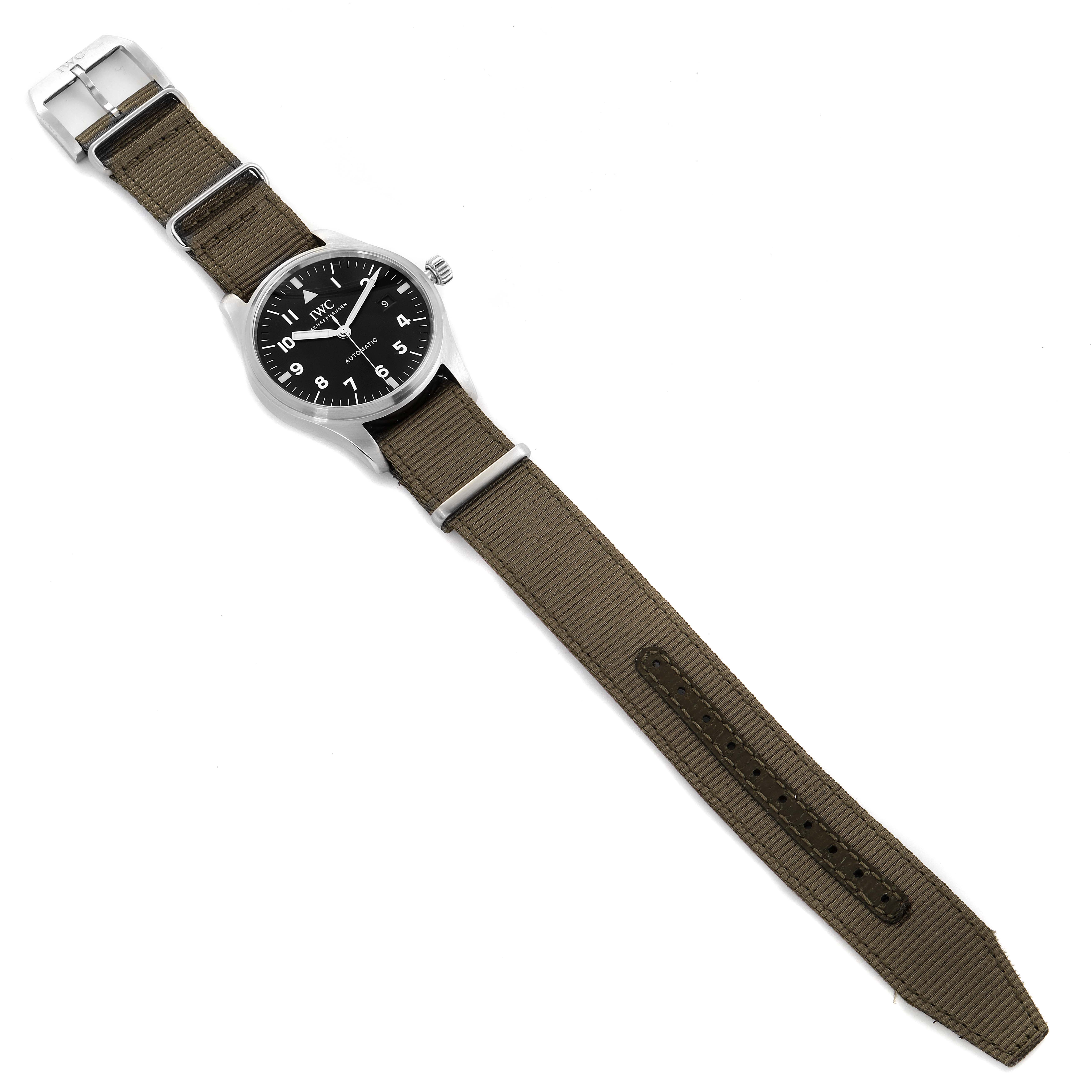 The IWC Pilot IW327007 Men's Stainless Steel Black Dial IW327007 Men's Stainless Steel Black Dial watch is shown from an overhead angle, displaying its face, strap, case, and buckle.