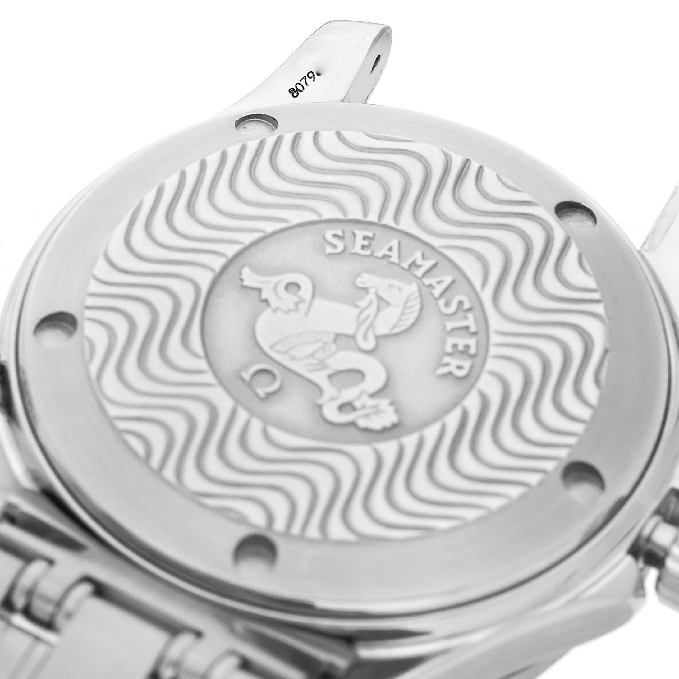 The image shows the case back of the Omega Seamaster 2551.80.00 Men's Stainless Steel Blue Dial watch with a wavy pattern and logo engraving.