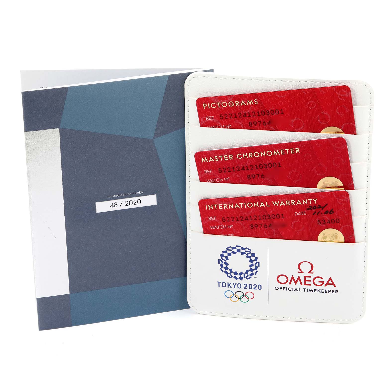 The image shows warranty cards and documentation for the Omega Aqua Terra 522.12.41.21.03.001 Men's Stainless Steel Blue Dial 522.12.41.21.03.001 Men's Stainless Steel Blue Dial model, including Tokyo 2020 branding.