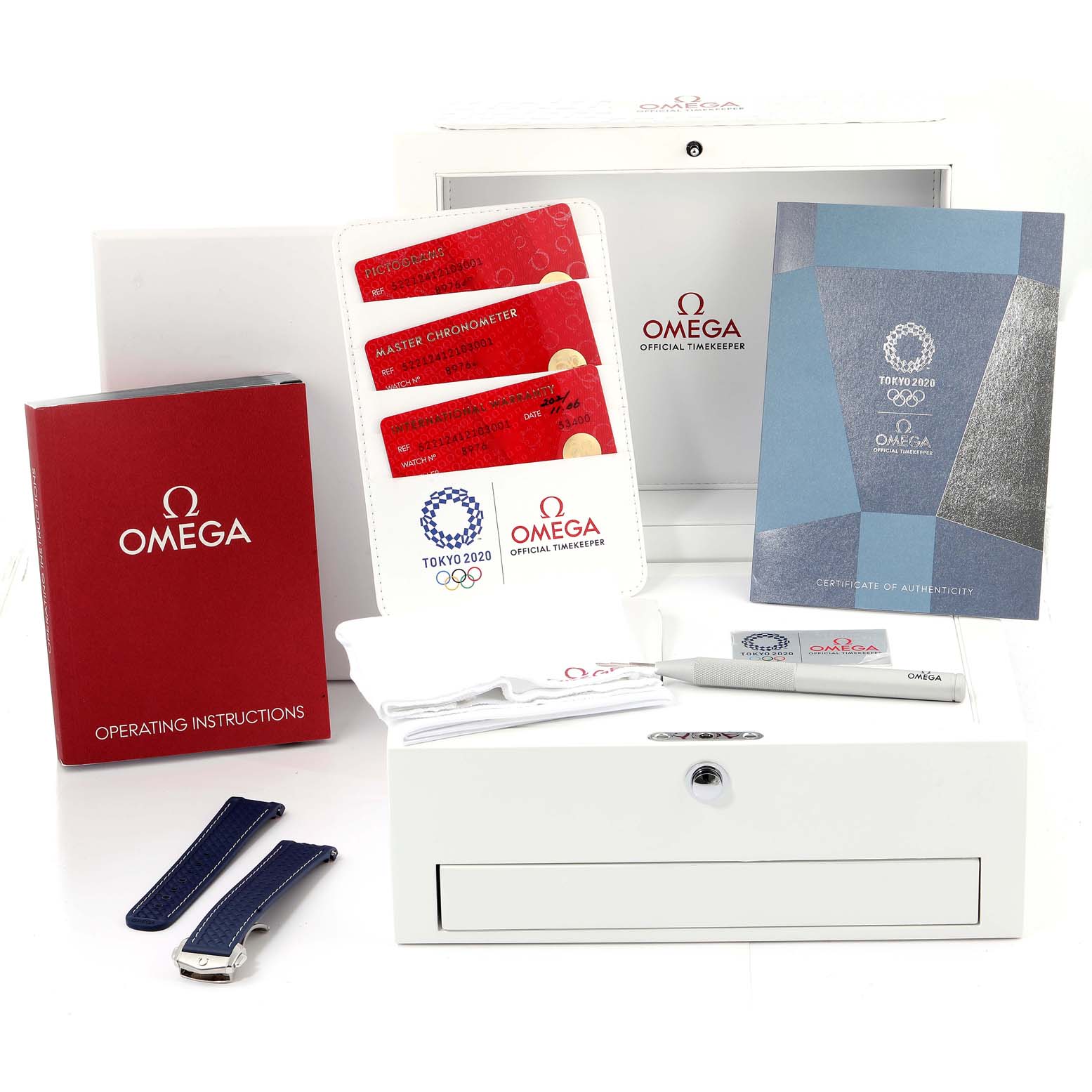 The image shows the packaging and accessories for the Omega Aqua Terra 522.12.41.21.03.001 Men's Stainless Steel Blue Dial 522.12.41.21.03.001 Men's Stainless Steel Blue Dial watch, including the box, instruction manual, warranty cards, and straps.