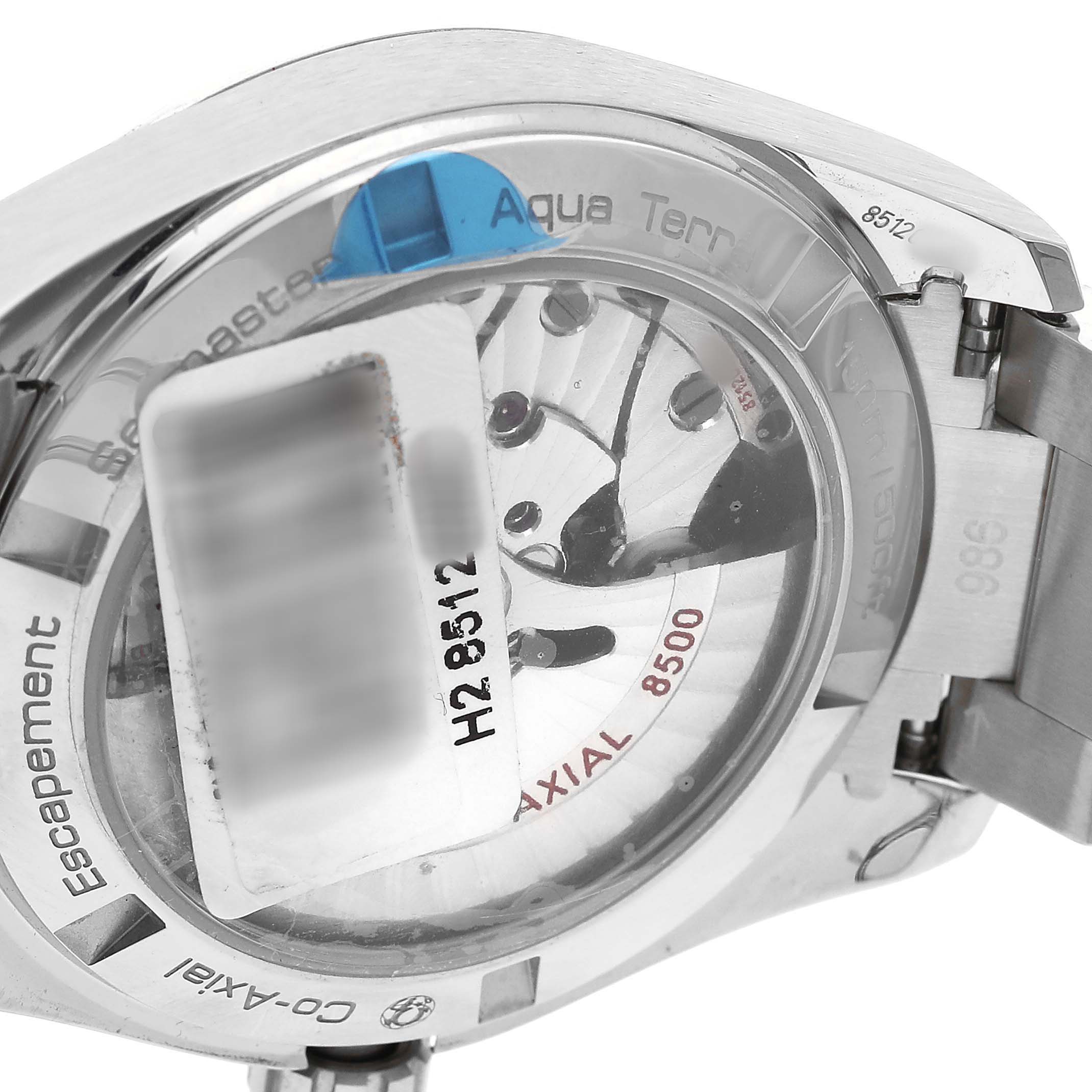 The image shows the back of the Omega Seamaster 231.10.39.21.54.001 Men's Stainless Steel White Dial watch, highlighting its Co-Axial movement and serial number.