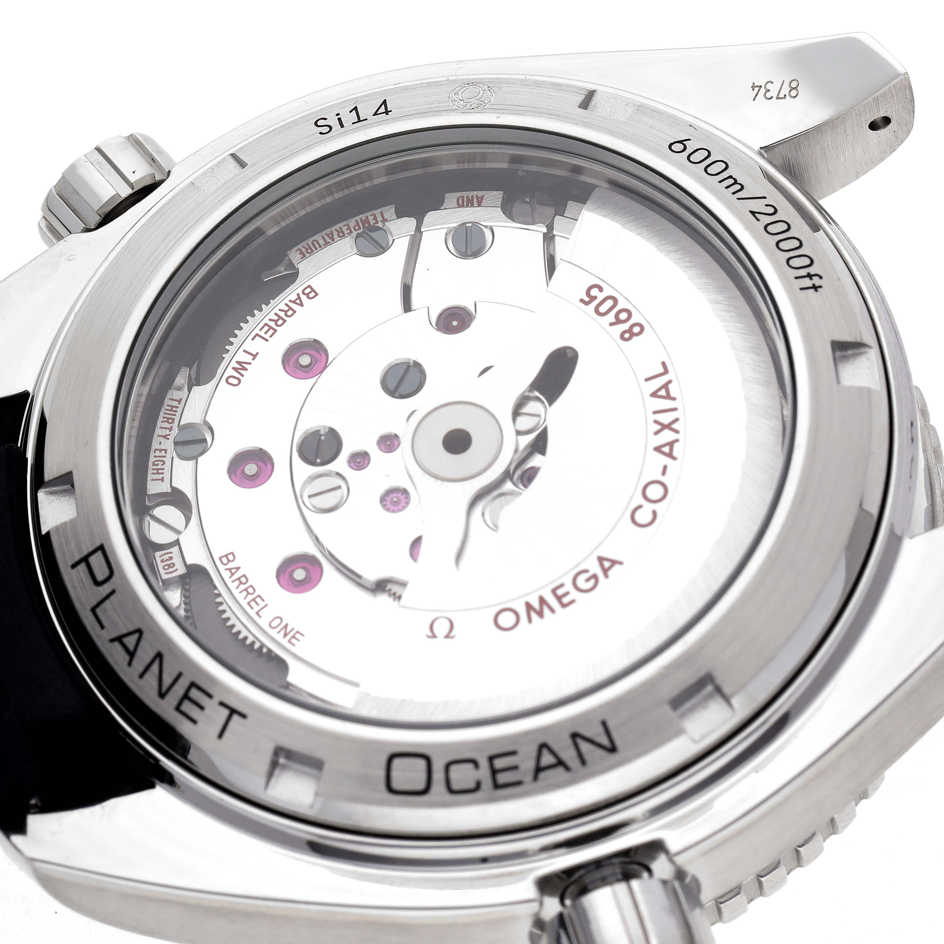 The image shows the case back of the Omega Planet Ocean 232.32.44.22.01.001 Men
s Stainless Steel Black Dial 232.32.44.22.01.001 Men
s Stainless Steel Black Dial, highlighting its inner mechanical movement and branding details.