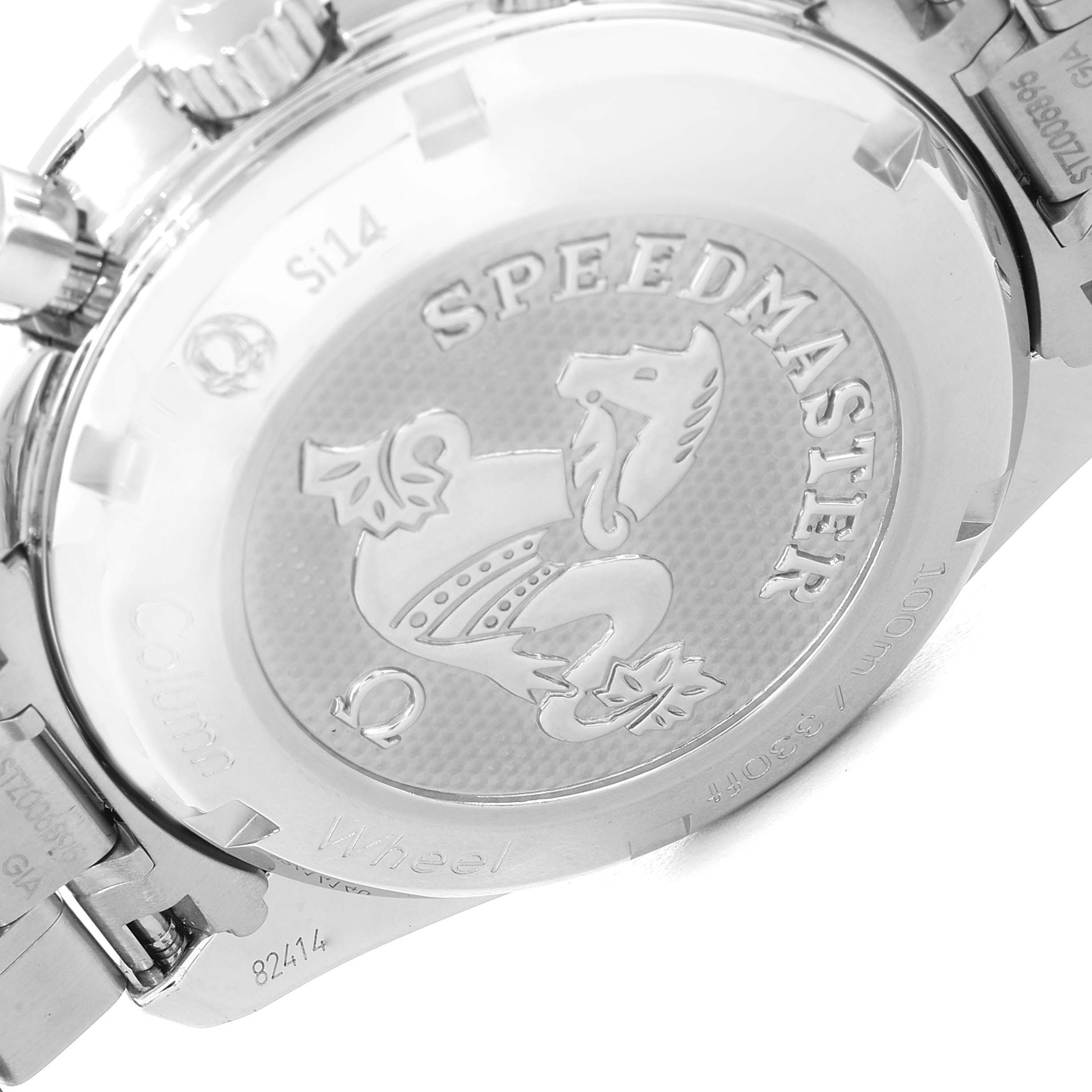 The image shows the back case of an Omega Speedmaster 324.30.38.50.02.001 Men
s Stainless Steel Silver Dial 324.30.38.50.02.001 Men
s Stainless Steel Silver Dial watch, highlighting the engraved logo and text.