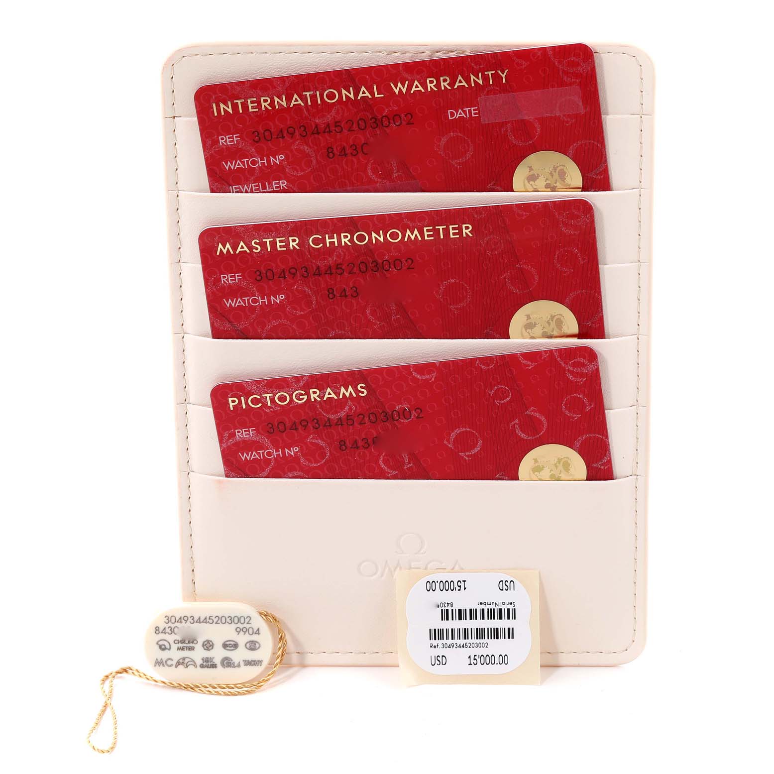 The image shows Omega Speedmaster 304.93.44.52.03.002 Men
s Ceramic Blue Dial 304.93.44.52.03.002 Men
s Ceramic Blue Dial warranty cards, a price tag, and a hang tag, viewed from above.