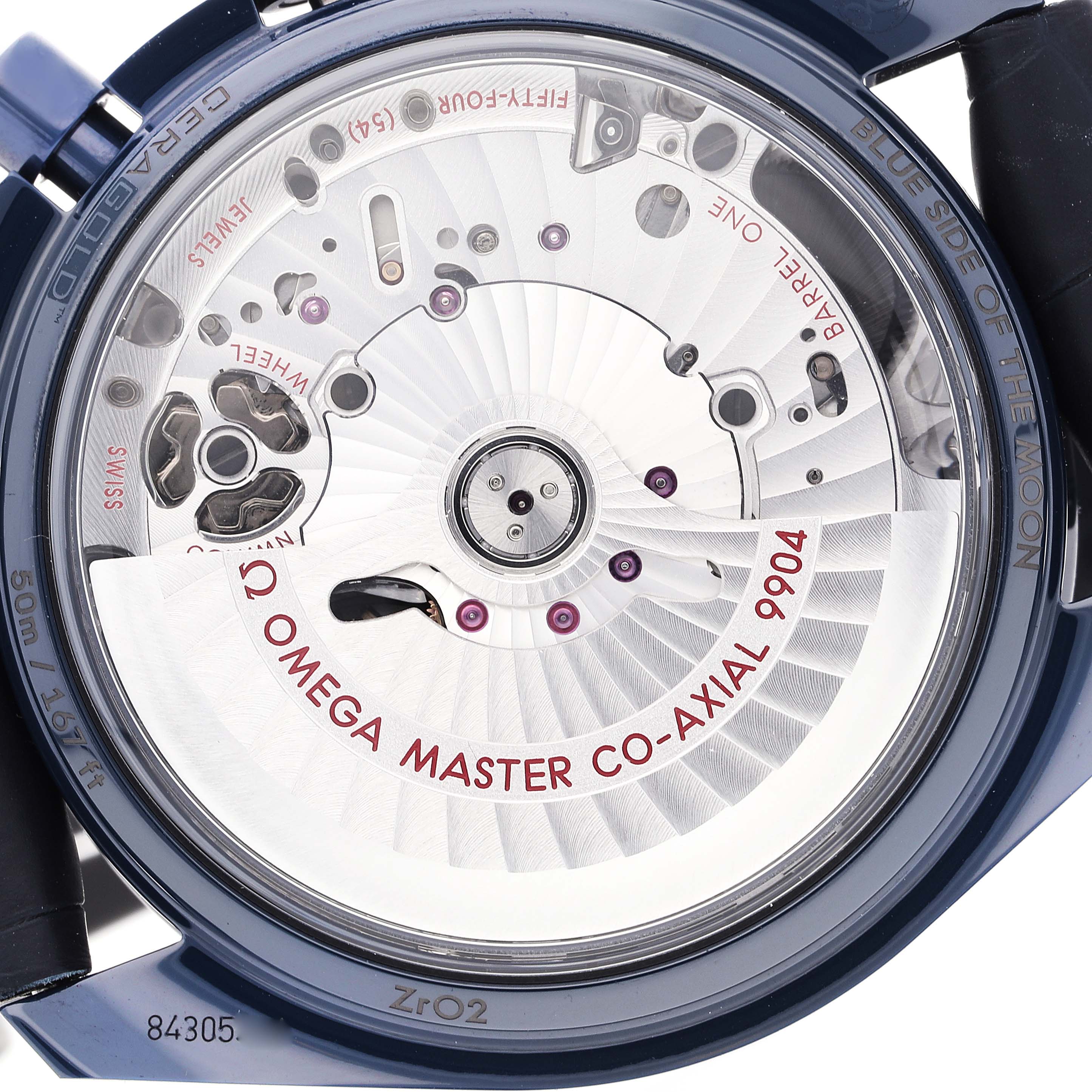 The image shows the back of the Omega Speedmaster 304.93.44.52.03.002 Men
s Ceramic Blue Dial 304.93.44.52.03.002 Men
s Ceramic Blue Dial, highlighting its movement and "Master Co-Axial 9904" mechanism.