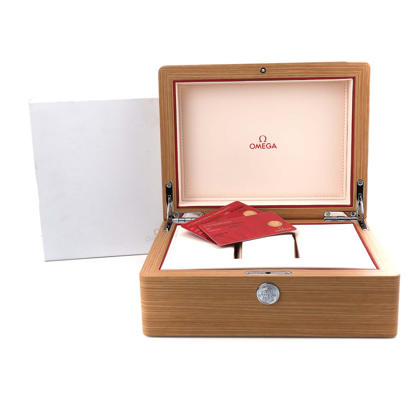 The image shows an open Omega Speedmaster 311.93.44.51.99.002 Men's Ceramic Grey Dial watch box with red Omega cards inside.