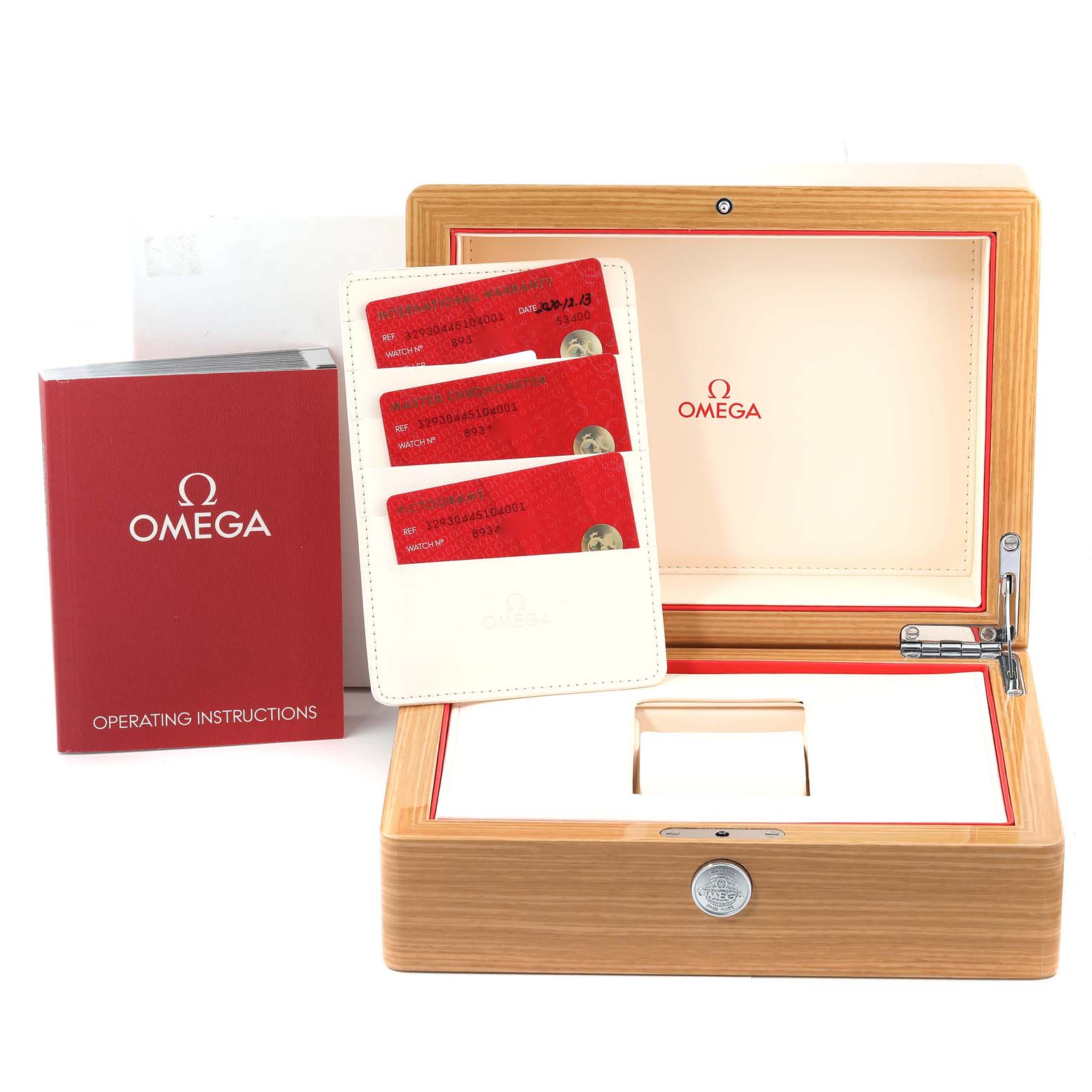 The image shows the accessories for an Omega Speedmaster 329.30.44.51.04.001 Men
s Stainless Steel White Dial 329.30.44.51.04.001 Men
s Stainless Steel White Dial watch, including the box, cards, and operating instructions.