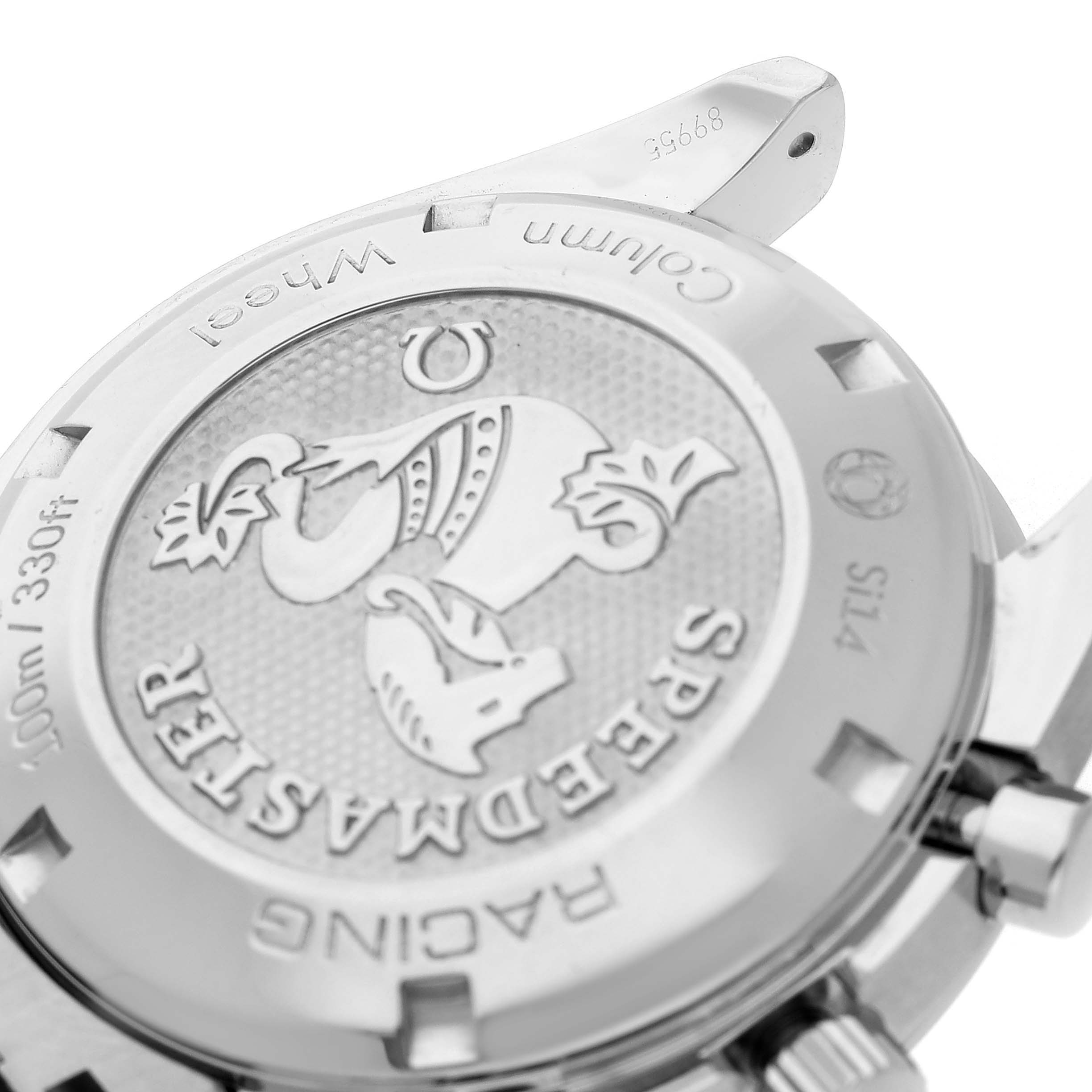 The image shows the back of an Omega Speedmaster 326.30.40.50.03.001 Men's Stainless Steel Blue Dial watch with "RACING" and the logo engraved, viewed at a slight angle.