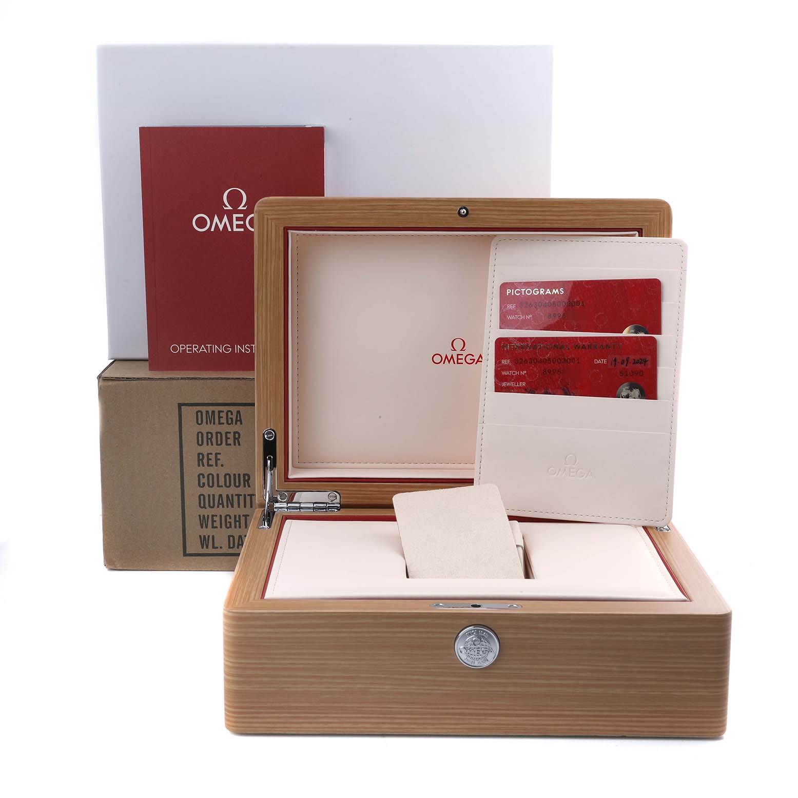 The image shows an Omega Speedmaster 326.30.40.50.03.001 Men's Stainless Steel Blue Dial watch box open, displaying the instruction manual, warranty cards, and holder.