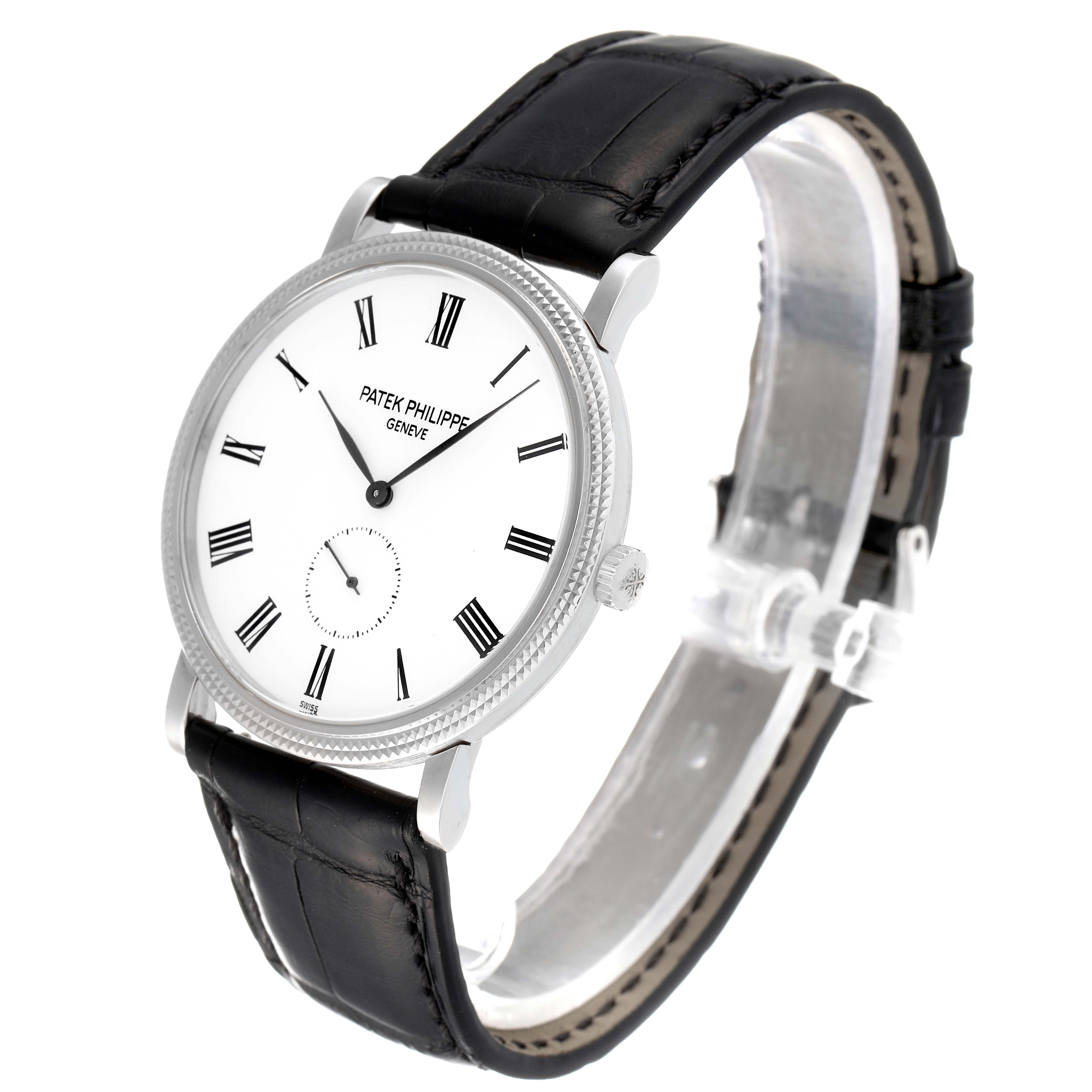 The Patek Philippe Calatrava 5119G Men's White Gold White Dial 5119G Men's White Gold White Dial watch is shown at a slight angle, highlighting the dial, case, crown, and leather strap.