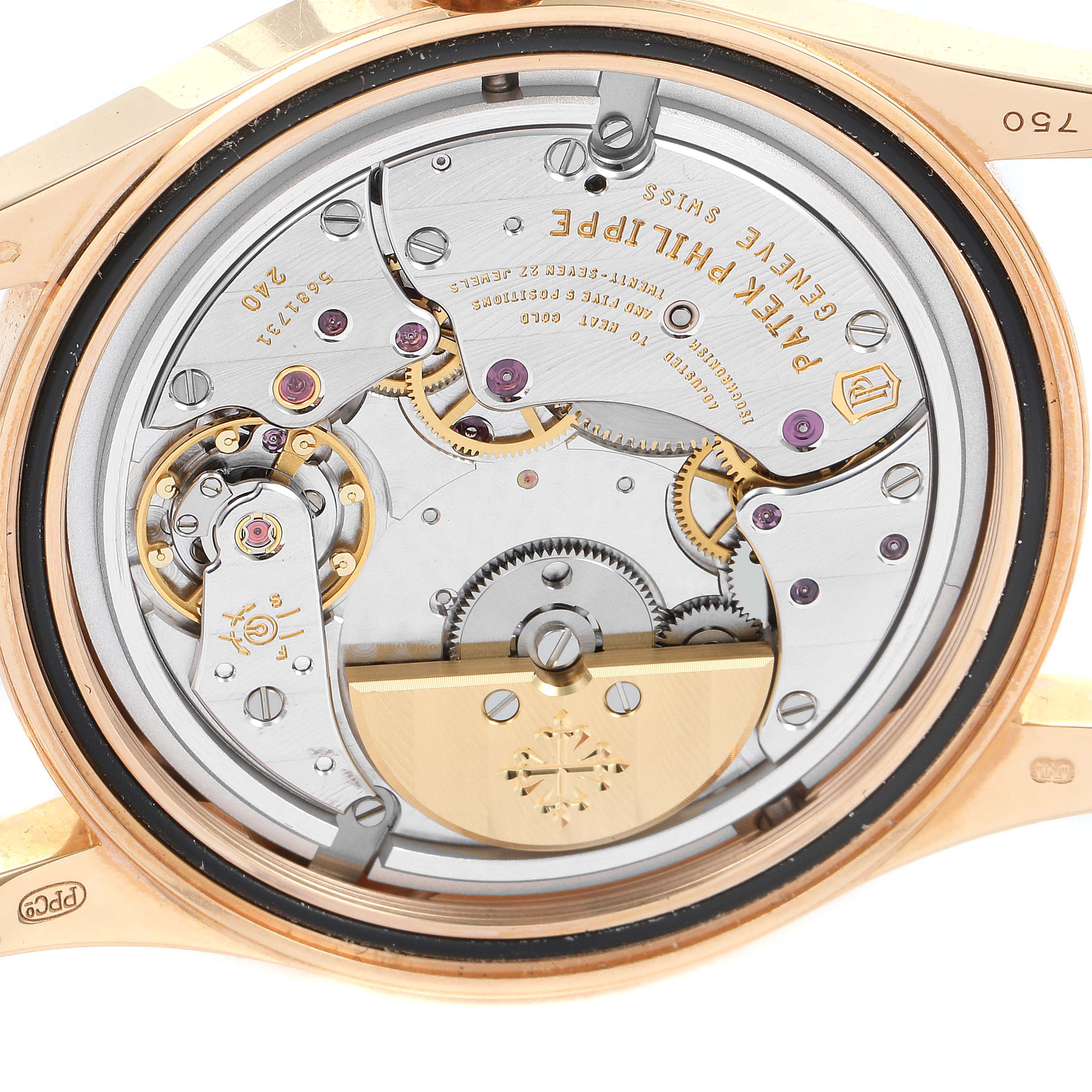 This image shows the intricate movement and inner workings of the Patek Philippe Calatrava 6000R Men's Rose Gold Brown Dial 6000R Men's Rose Gold Brown Dial watch from a rear angle.